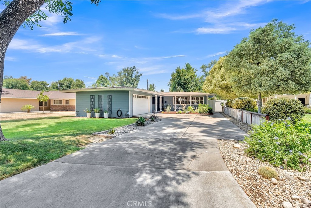 4231 Maplewood Place Riverside, CA 92506 - Photo 31 of 33 a view of a house with a yard