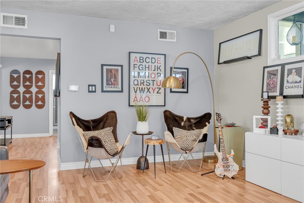 4231 Maplewood Place Riverside, CA 92506 - Photo 5 of 33 a living room with furniture and wooden floor