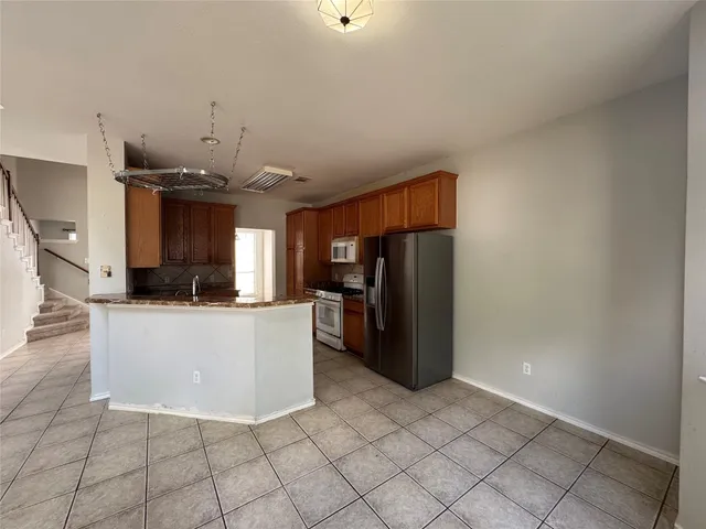 a view of living room and kitchen with furniture