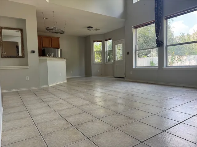a view of a kitchen with furniture and windows