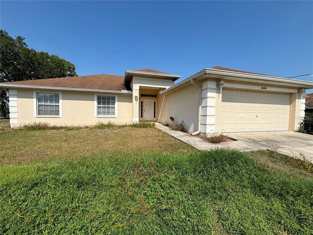 1444 Hastings Road Spring Hill, FL 34608 - Photo 1 of 1 a front view of house with yard