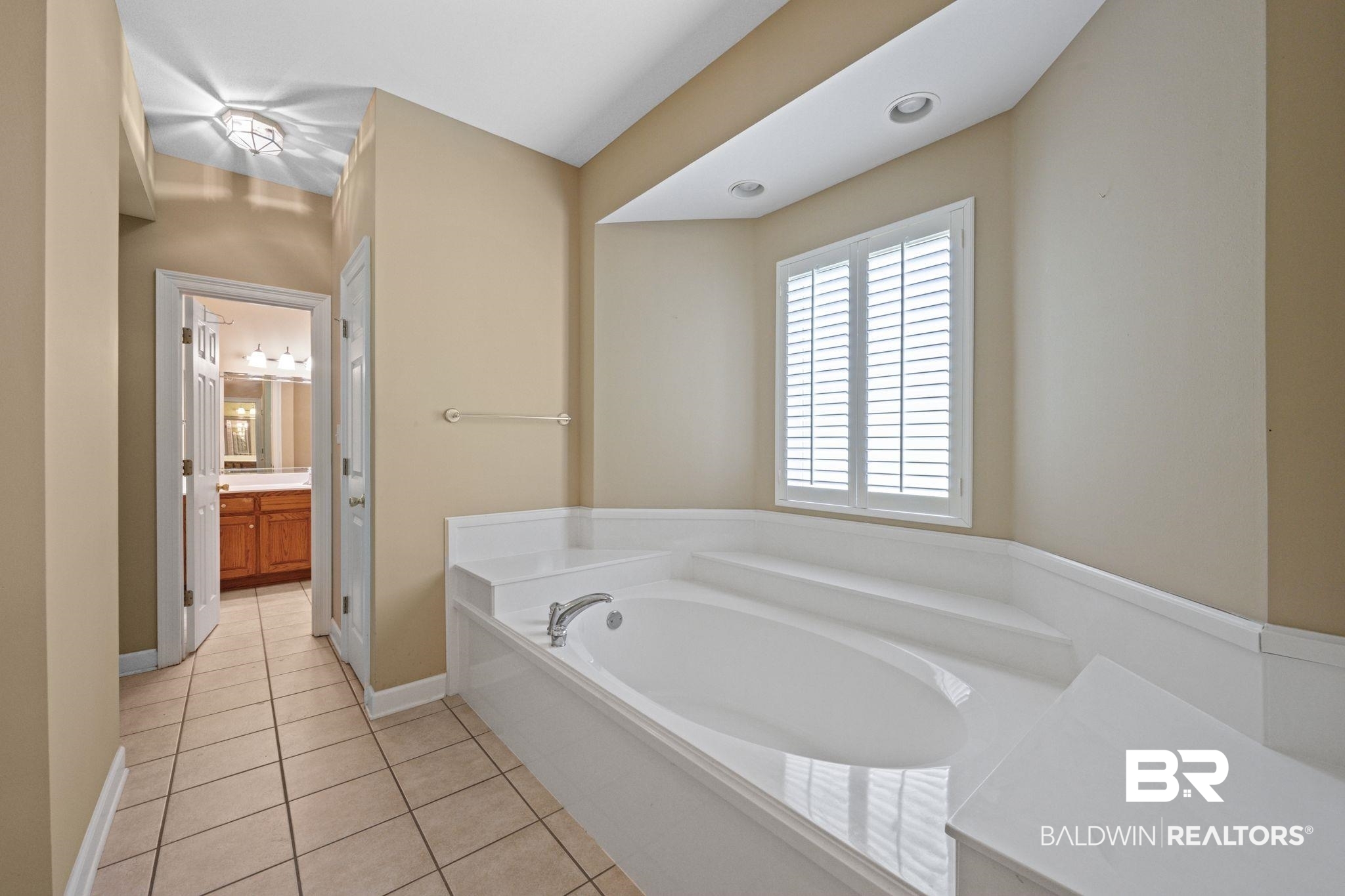 5618 Leytham Road Theodore, AL 36582 - Photo 31 of 60 Bathroom featuring vanity, a bathtub, and tile patterned floors