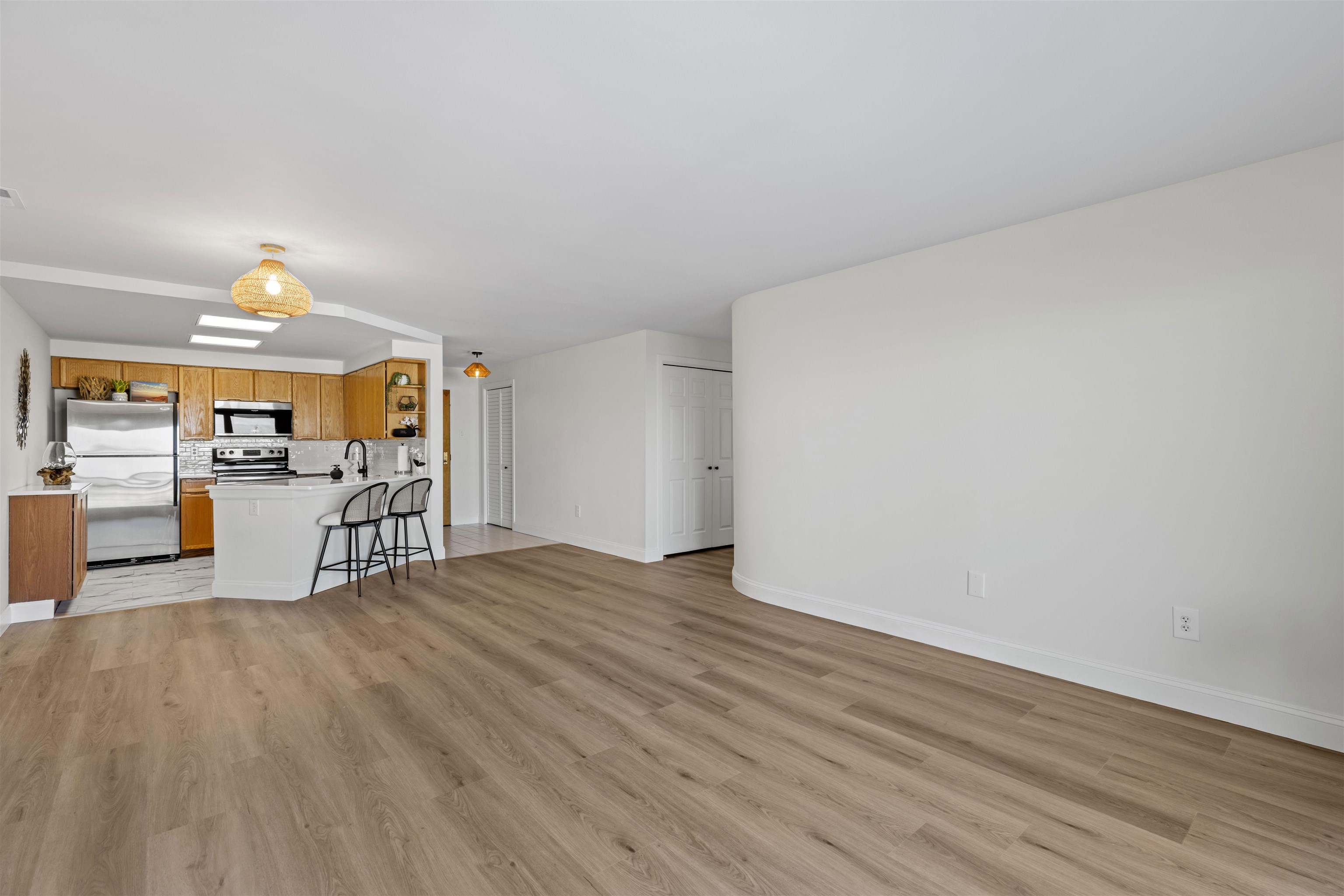 100 96th Street, Unit 304 Stone Harbor, NJ 08247 - Photo 12 of 34 a view of a room with wooden floor table and chairs
