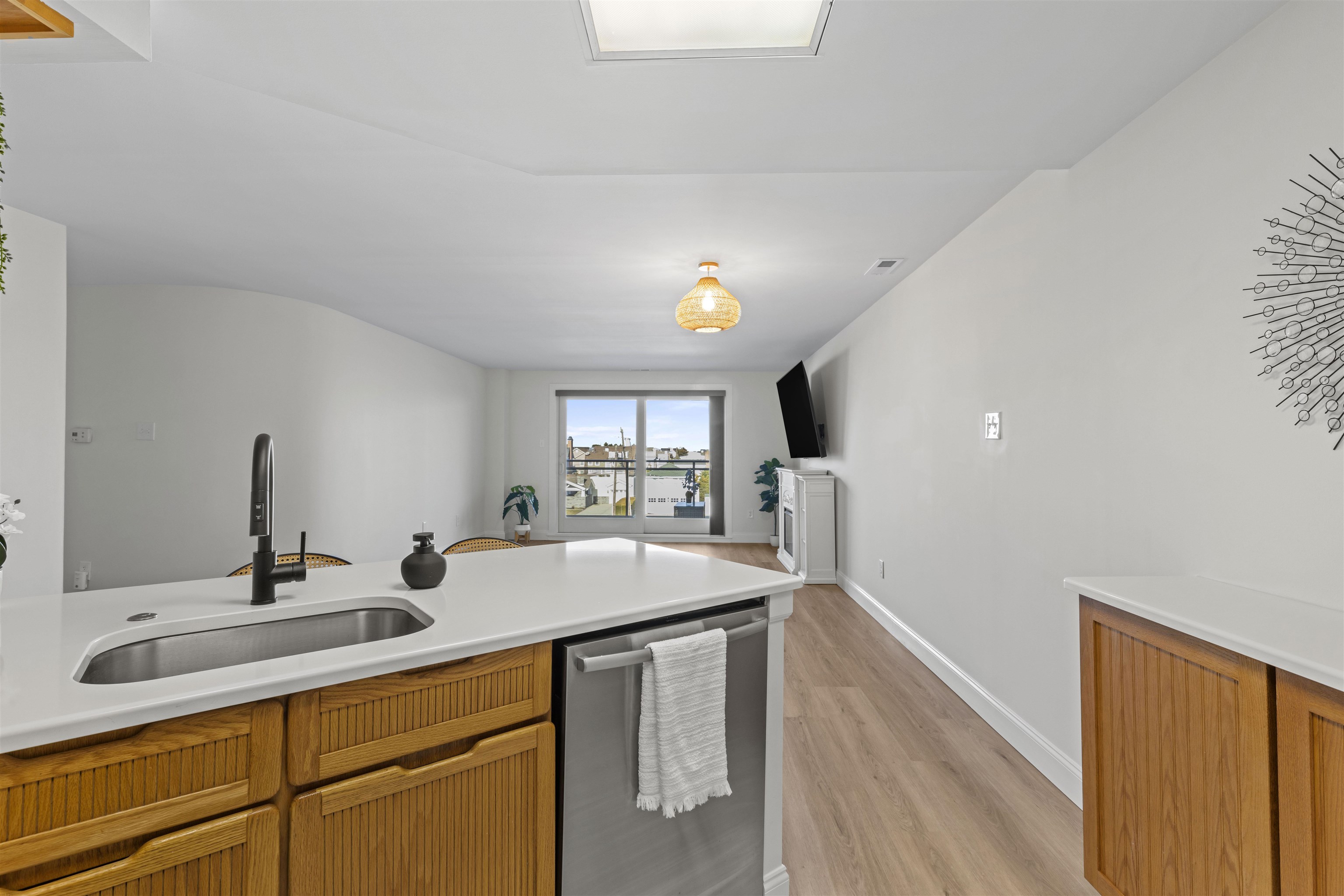 100 96th Street, Unit 304 Stone Harbor, NJ 08247 - Photo 15 of 34 a kitchen with a sink and a refrigerator