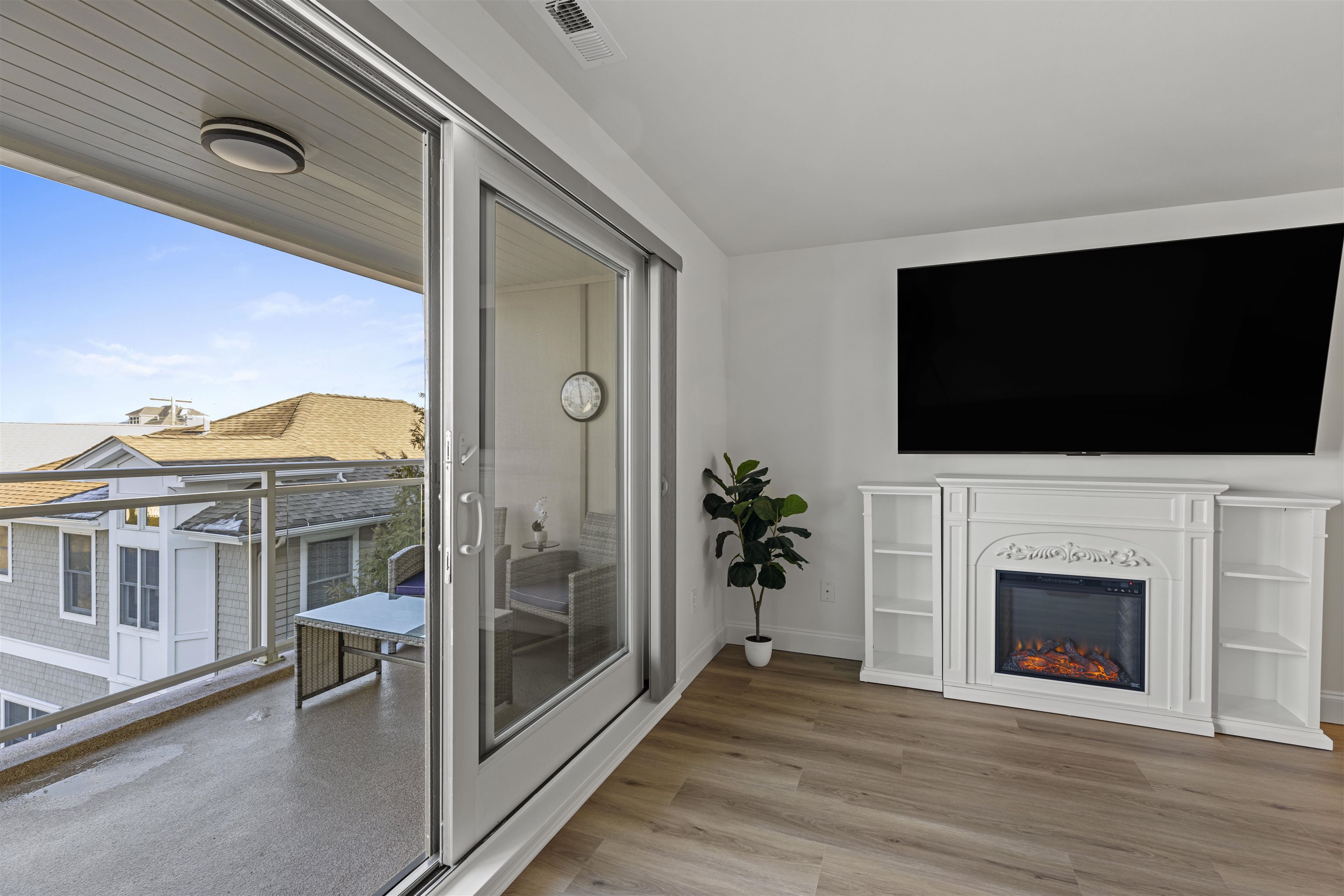 100 96th Street, Unit 304 Stone Harbor, NJ 08247 - Photo 17 of 34 a view of a livingroom with an empty space and a fireplace