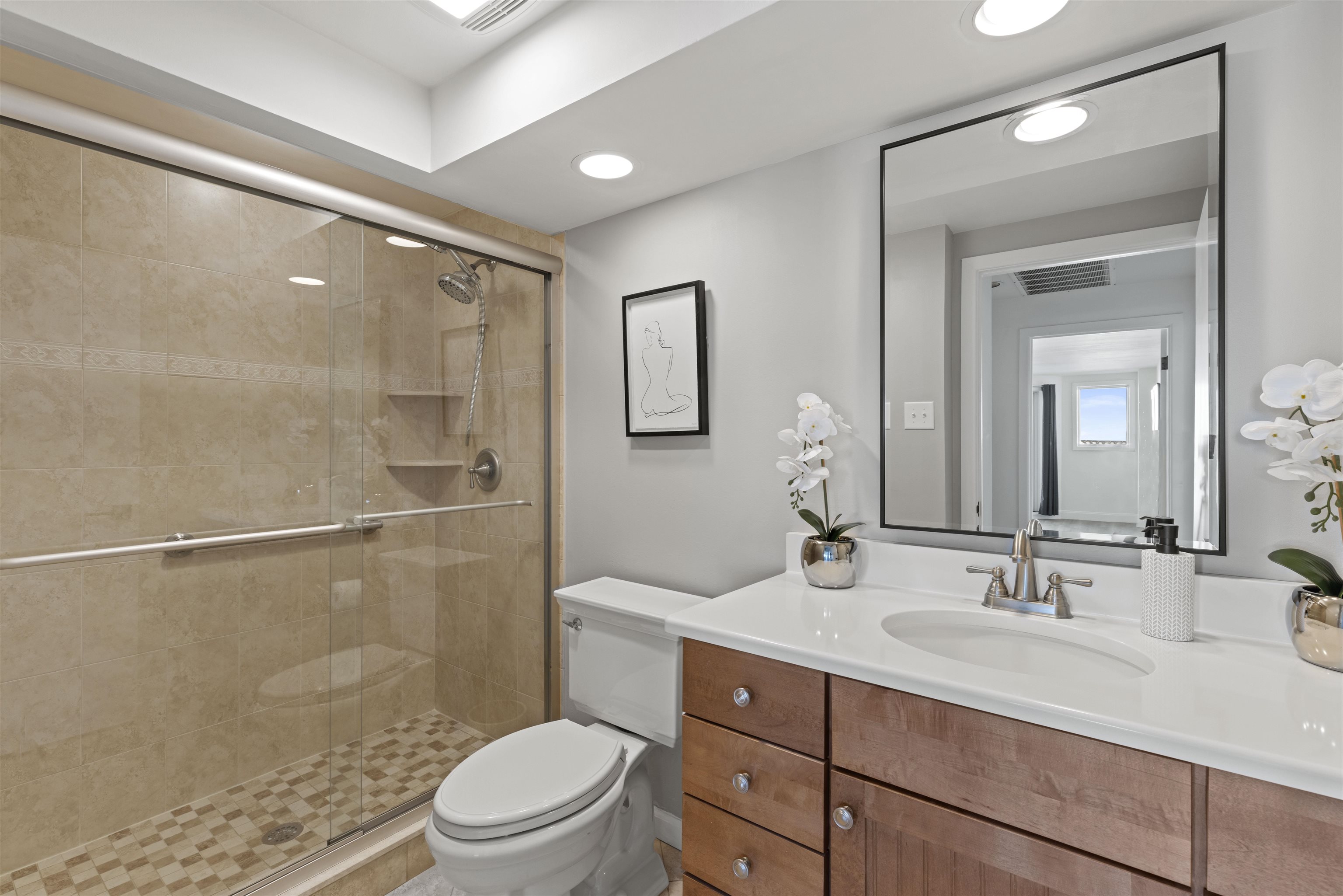 100 96th Street, Unit 304 Stone Harbor, NJ 08247 - Photo 21 of 34 a bathroom with a granite countertop sink toilet a mirror and shower