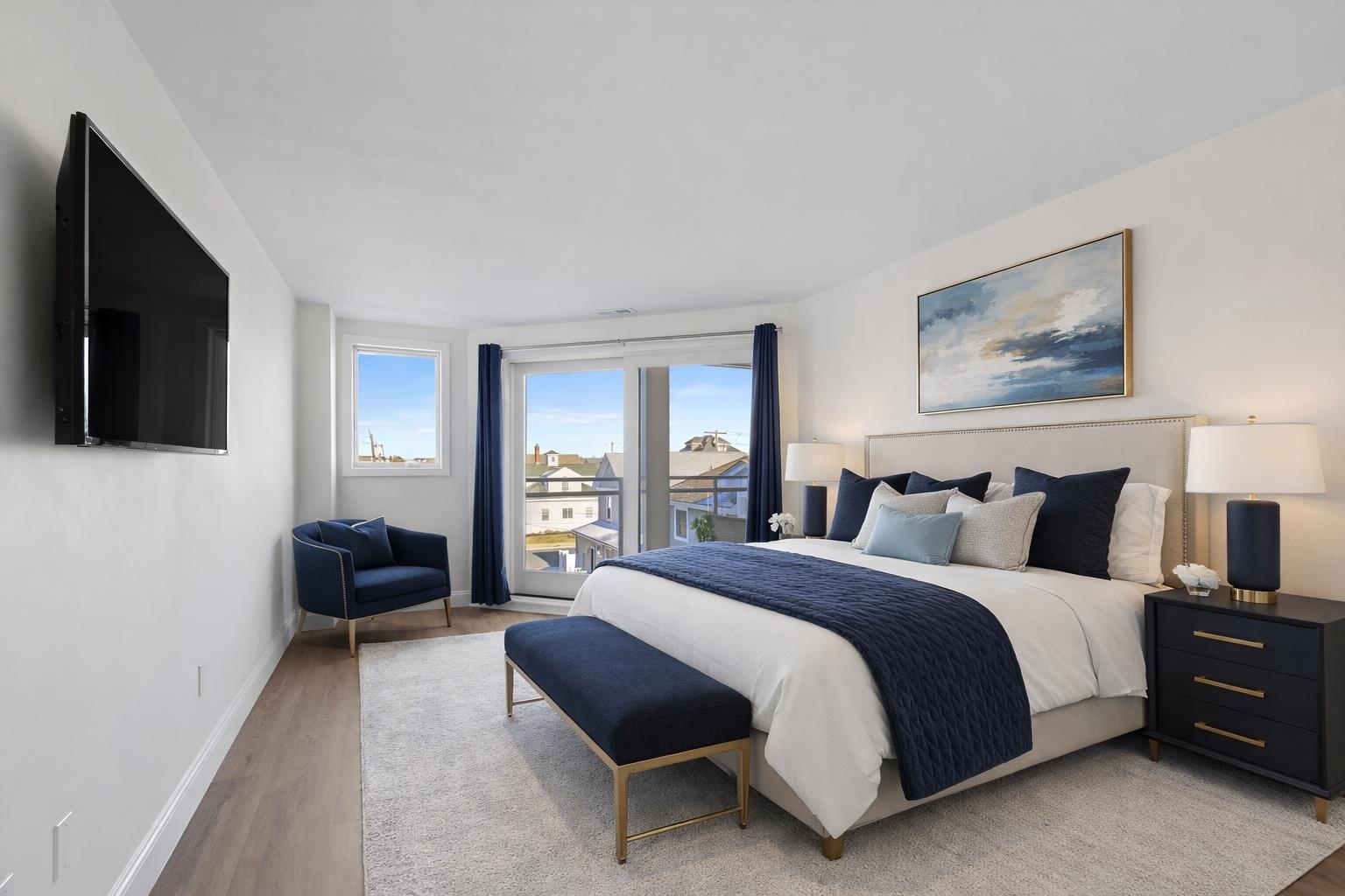 100 96th Street, Unit 304 Stone Harbor, NJ 08247 - Photo 22 of 34 a spacious bedroom with a bed and a couch