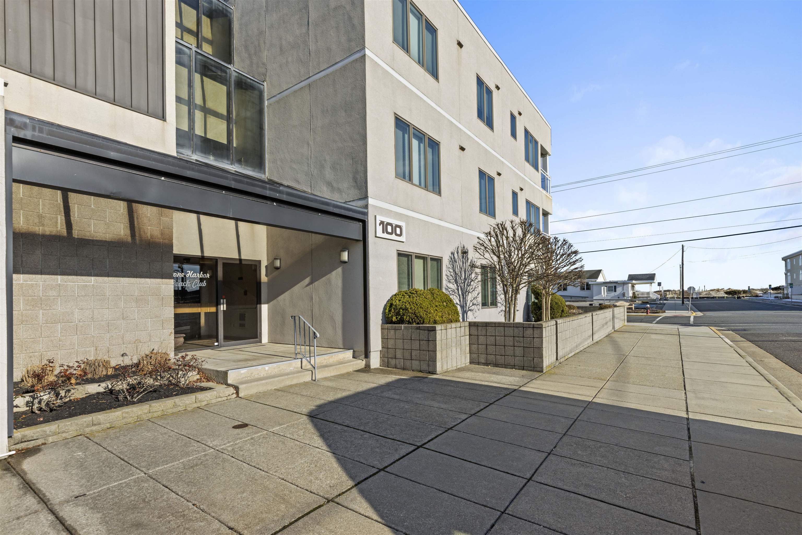 100 96th Street, Unit 304 Stone Harbor, NJ 08247 - Photo 8 of 34 a view of a building with a outdoor space