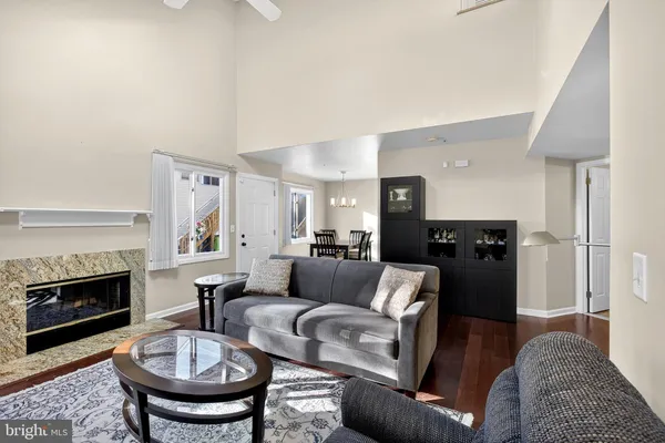 a living room with furniture a fireplace and a fireplace