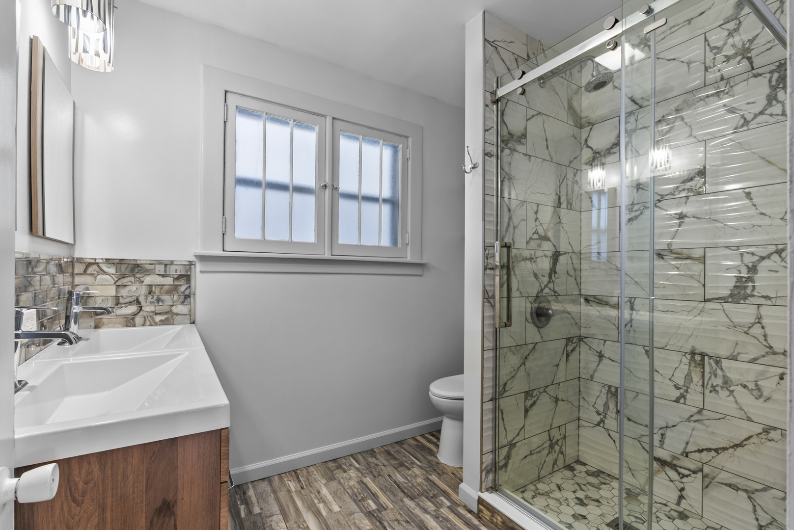 446 Seminary Avenue Aurora, IL 60505 - Photo 12 of 41 a bathroom with a sink toilet and shower