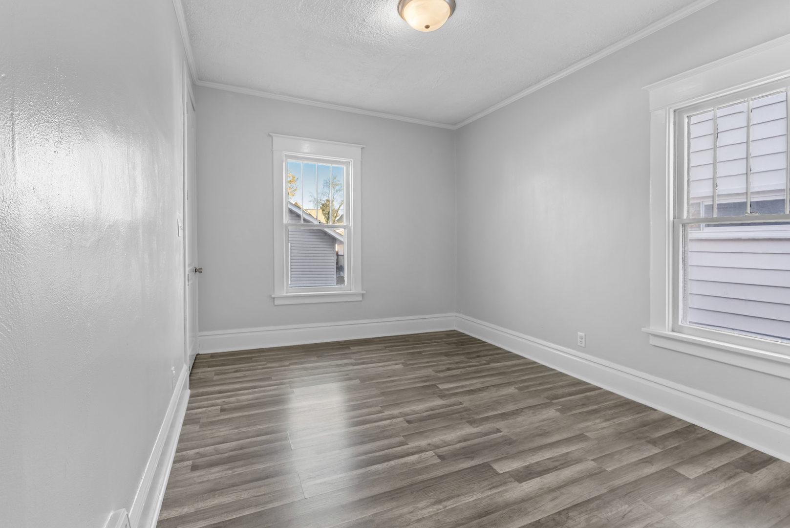 446 Seminary Avenue Aurora, IL 60505 - Photo 14 of 41 wooden floor in an empty room with a window