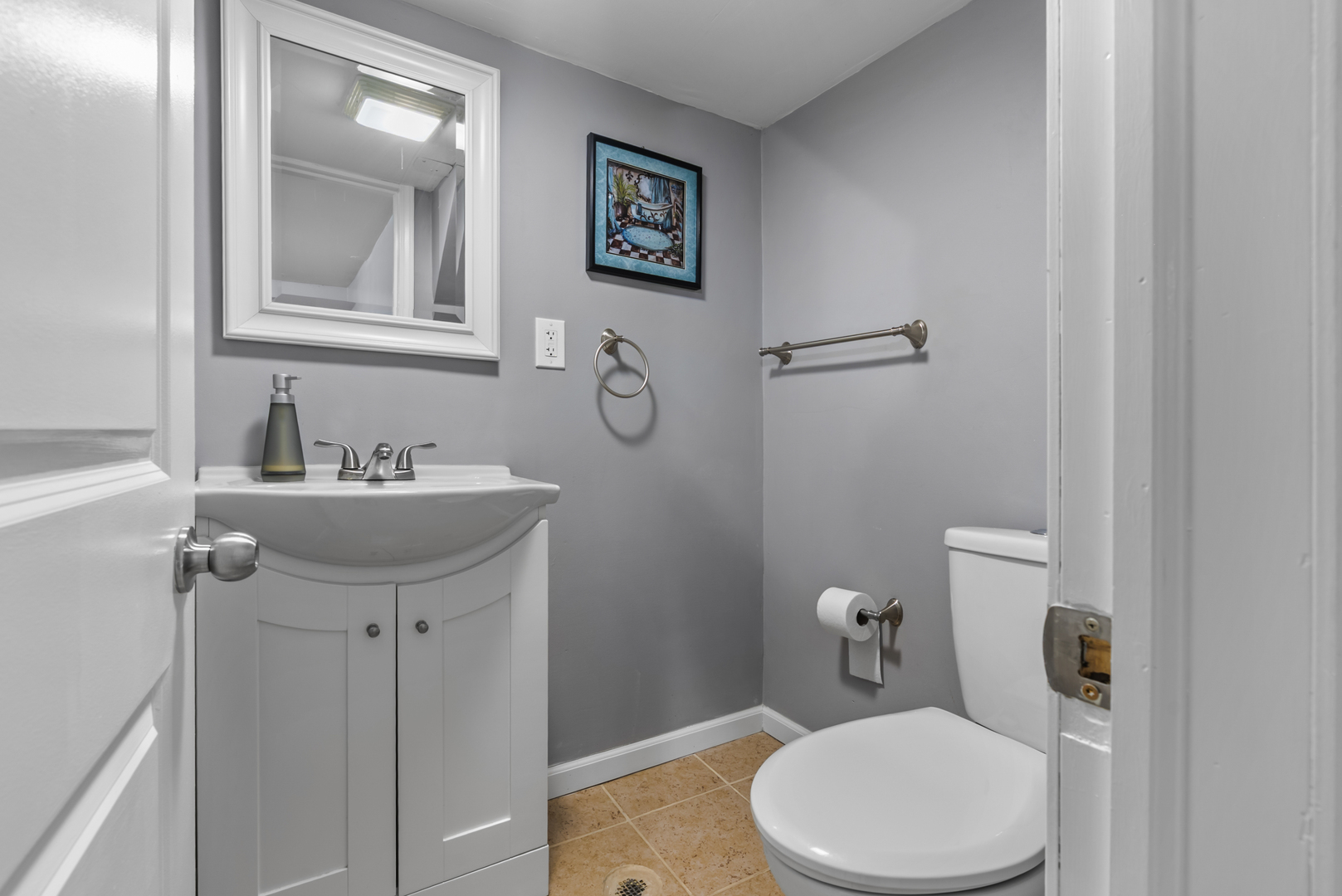 446 Seminary Avenue Aurora, IL 60505 - Photo 28 of 41 a bathroom with a toilet sink and mirror