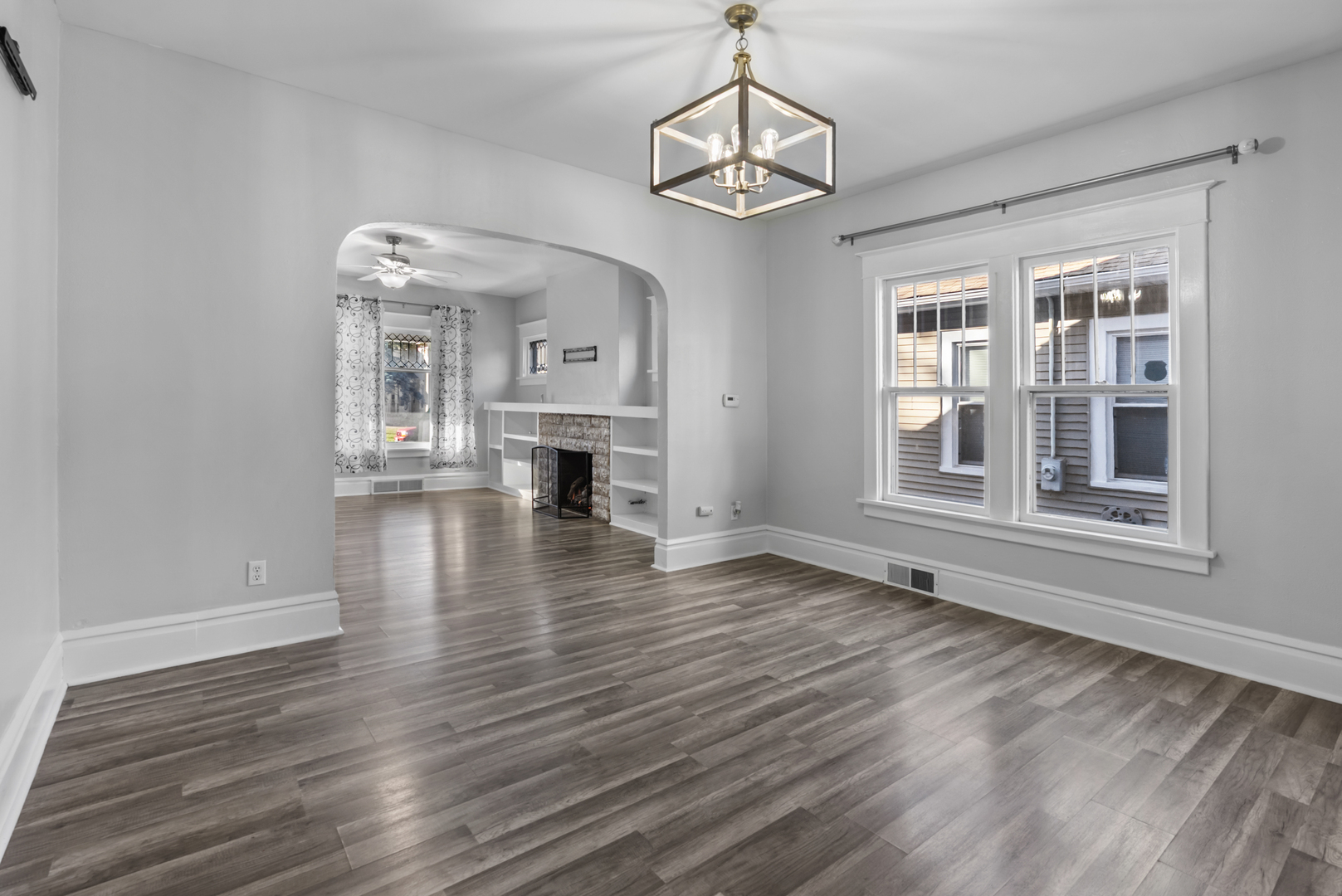 446 Seminary Avenue Aurora, IL 60505 - Photo 5 of 41 a view of empty room with wooden floor and window