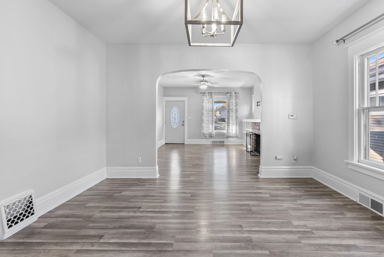 446 Seminary Avenue Aurora, IL 60505 - Photo 6 of 41 wooden floor in an empty room with a window