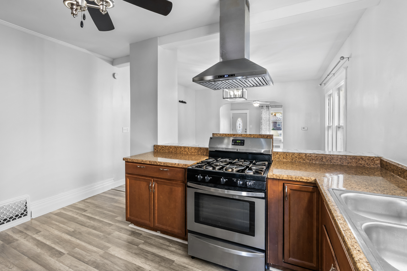 446 Seminary Avenue Aurora, IL 60505 - Photo 8 of 41 a kitchen with stainless steel appliances granite countertop a stove and a sink with granite countertops