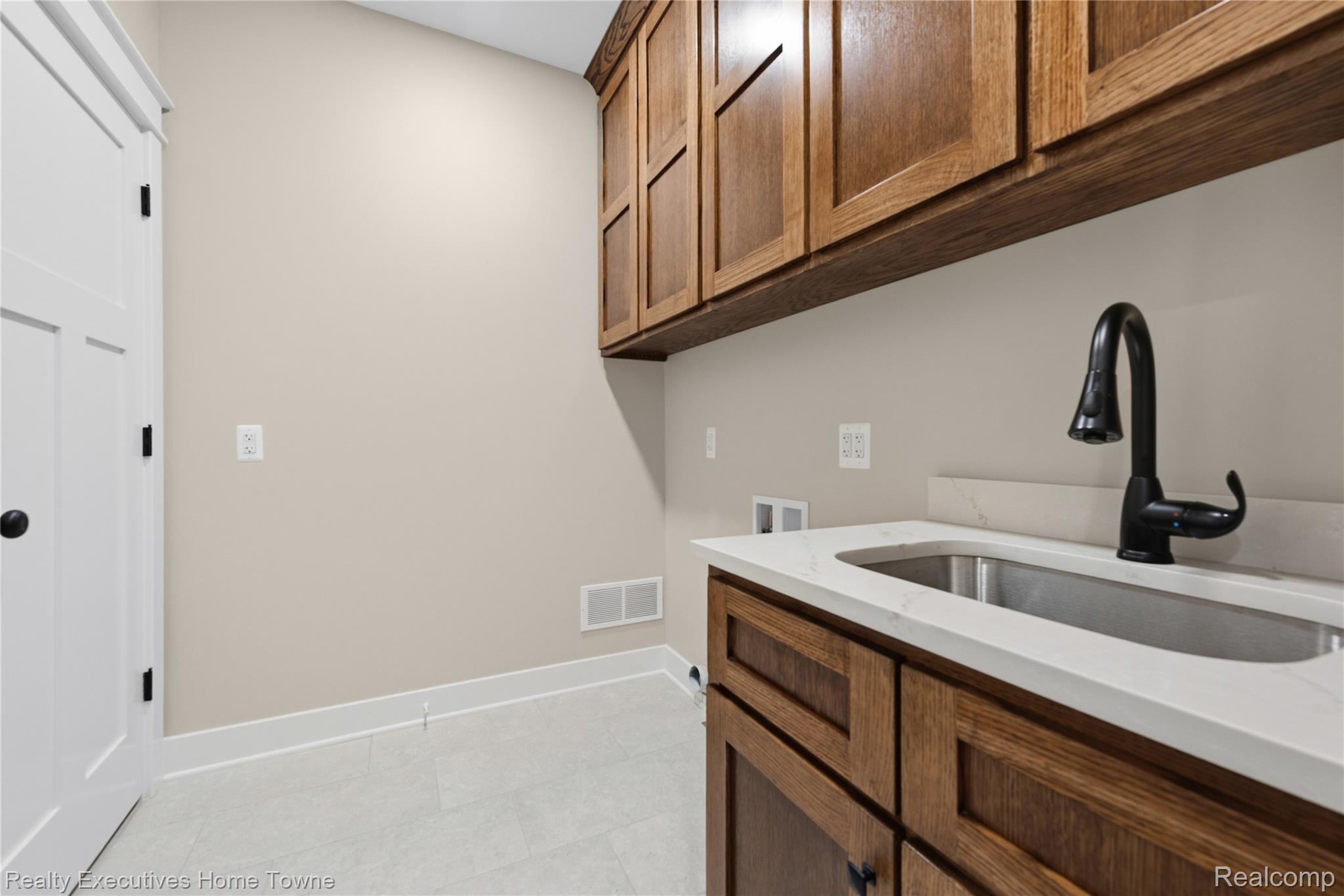 26850 Irwin Road Richmond, MI 48062 - Photo 22 of 47 Laundry area featuring washer hookup and cabinet space