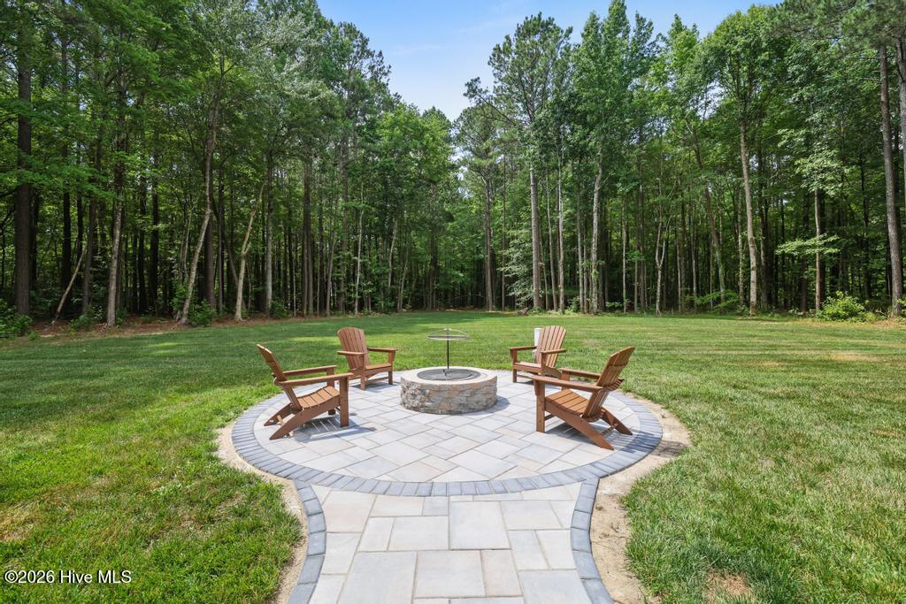 258 Guinea Mill Road Moyock, NC 27958 - Photo 25 of 54 Fire pit off of Deck.