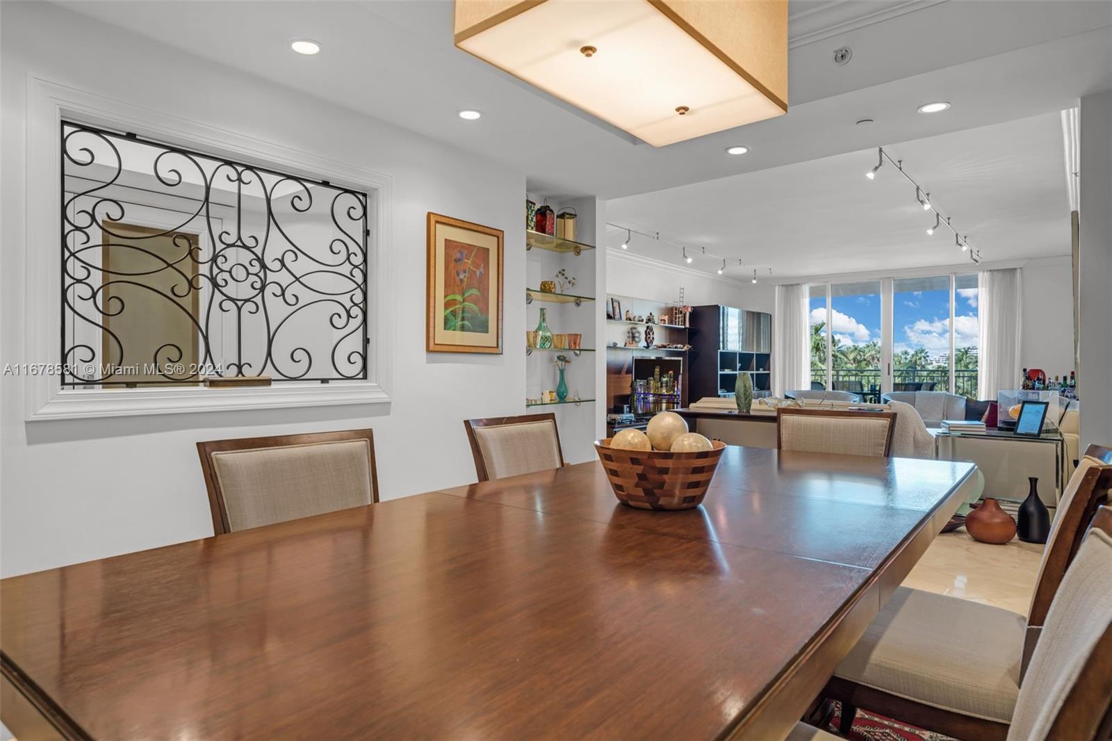 765 Crandon Boulevard, Unit 305 Key Biscayne, FL 33149 - Photo 13 of 55 a living room with furniture and a large window
