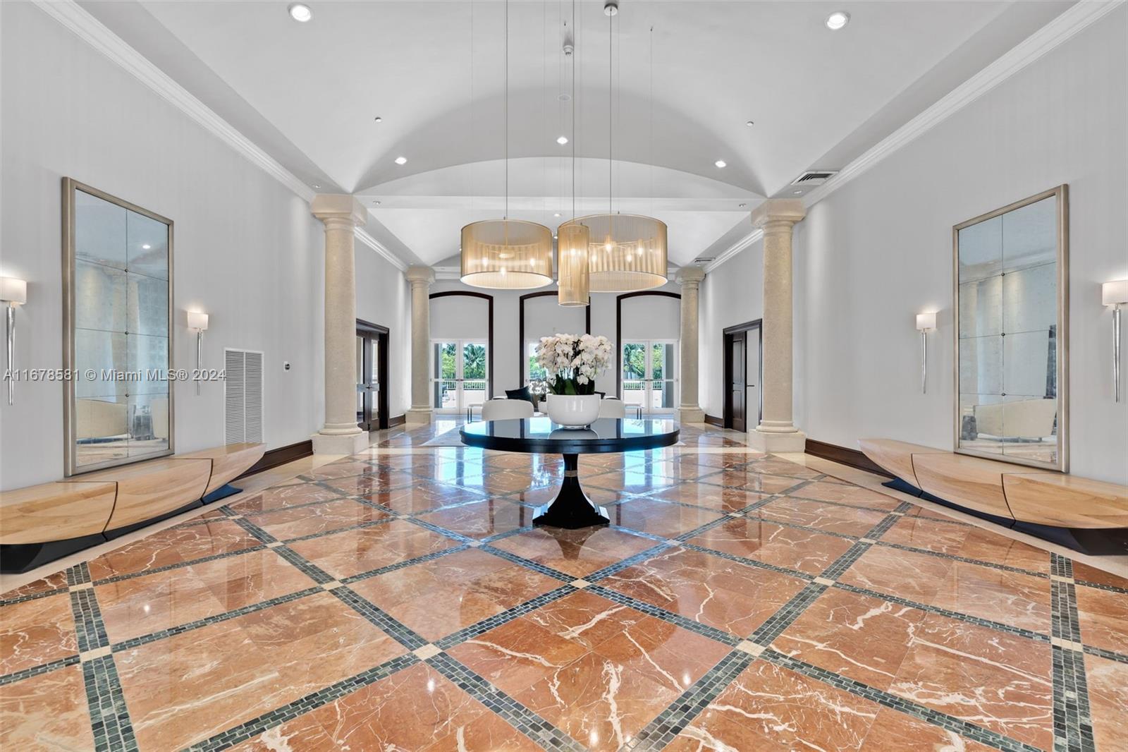 765 Crandon Boulevard, Unit 305 Key Biscayne, FL 33149 - Photo 54 of 55 a view of a lobby with furniture and a large window