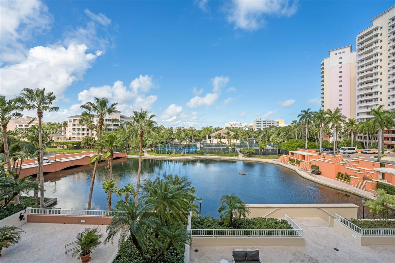 765 Crandon Boulevard, Unit 305 Key Biscayne, FL 33149 - Photo 7 of 55 a view of a swimming pool with a lake view