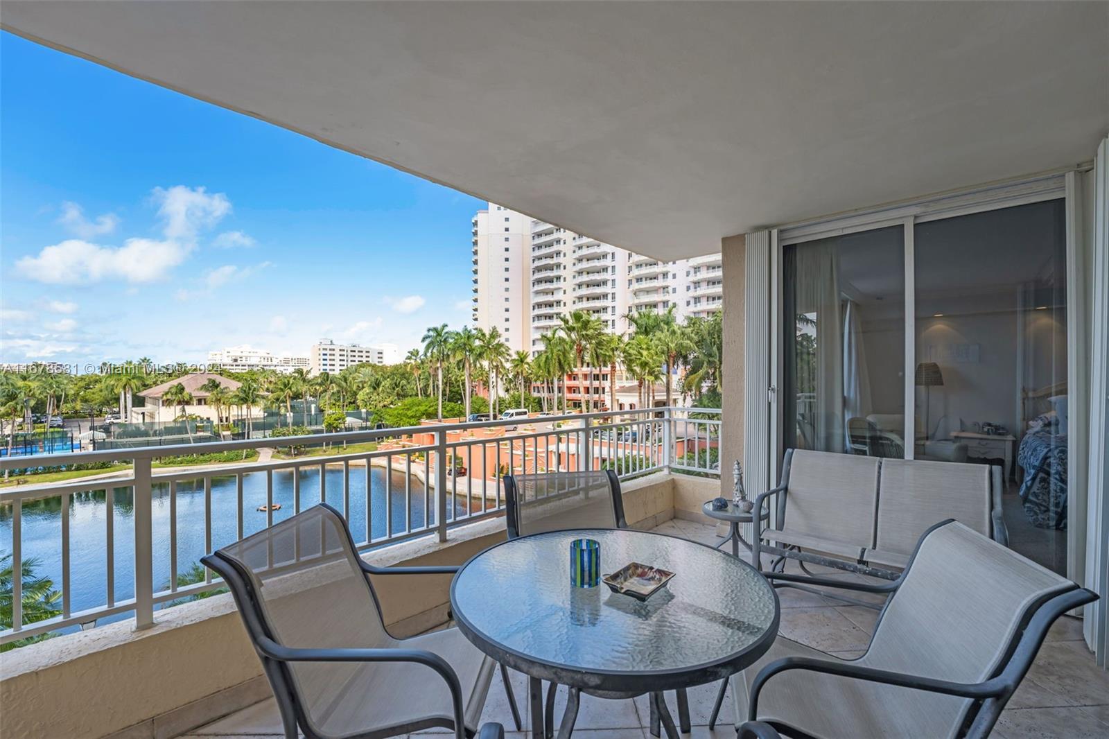 765 Crandon Boulevard, Unit 305 Key Biscayne, FL 33149 - Photo 9 of 55 a view of a chair and table in the balcony