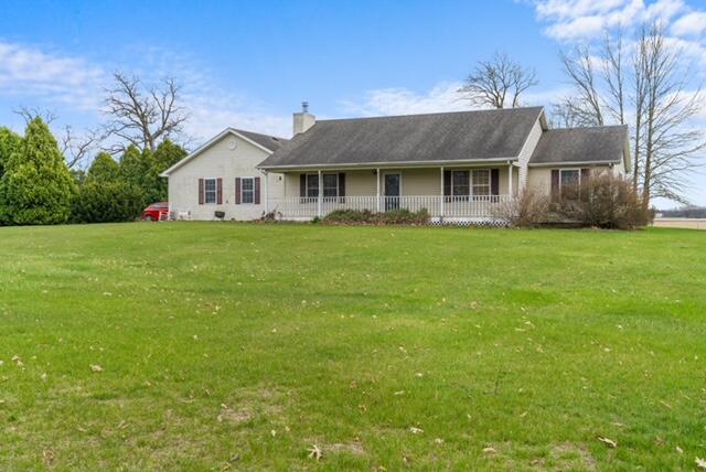 13318 Robin Lane Wheatfield, IN 46392 - Photo 1 of 17 a front view of a house with a garden