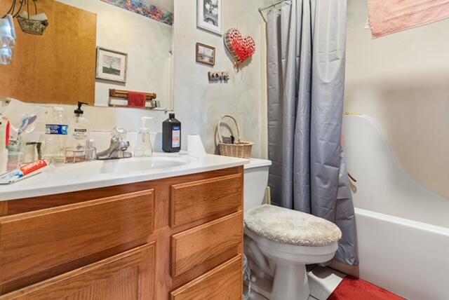 13318 Robin Lane Wheatfield, IN 46392 - Photo 15 of 17 a bathroom with a sink a toilet and shower curtain