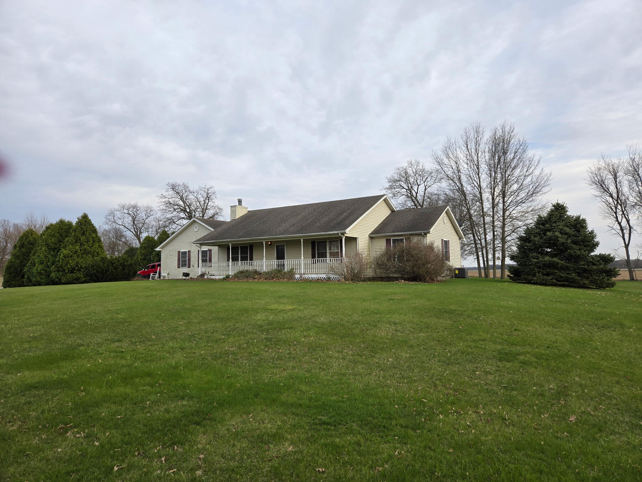 13318 Robin Lane Wheatfield, IN 46392 - Photo 2 of 17 a front view of a house with a garden