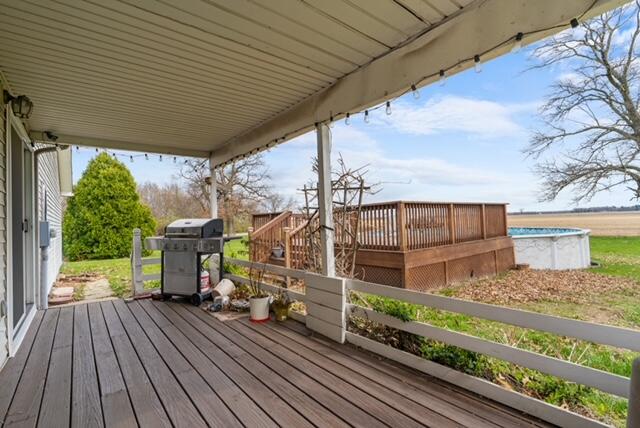 13318 Robin Lane Wheatfield, IN 46392 - Photo 4 of 17 a view of a wooden deck with a yard