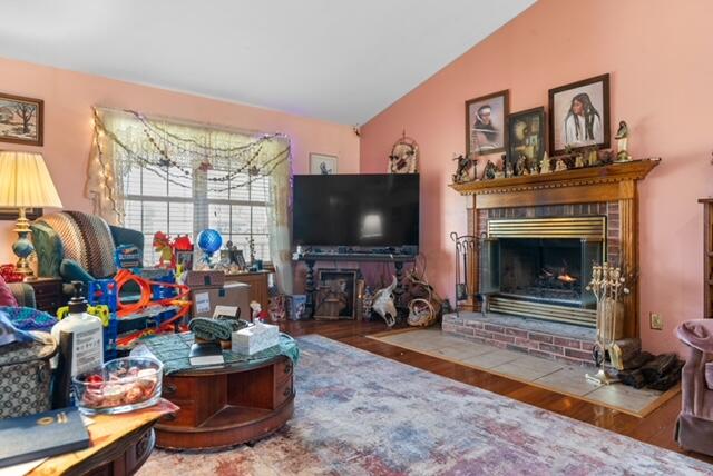 13318 Robin Lane Wheatfield, IN 46392 - Photo 5 of 17 a living room with furniture a flat screen tv and a fireplace