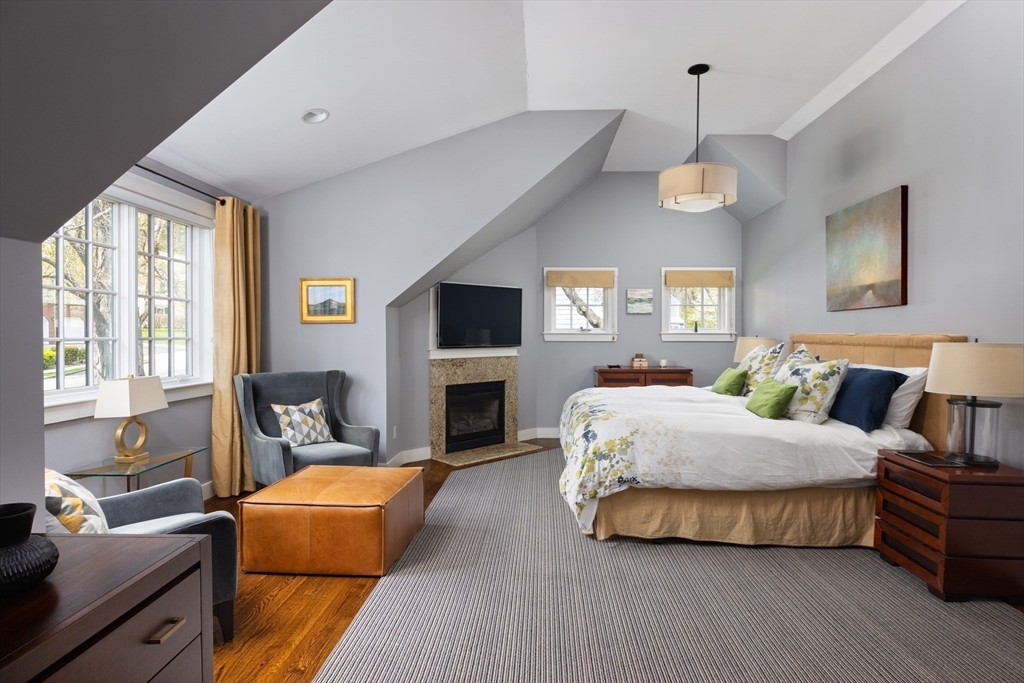 98 Annawan Road Newton, MA 02468 - Photo 11 of 30 a spacious bedroom with a bed chandelier and window