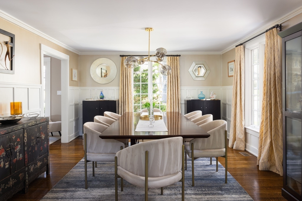 98 Annawan Road Newton, MA 02468 - Photo 7 of 30 a dining room with furniture a chandelier and wooden floor