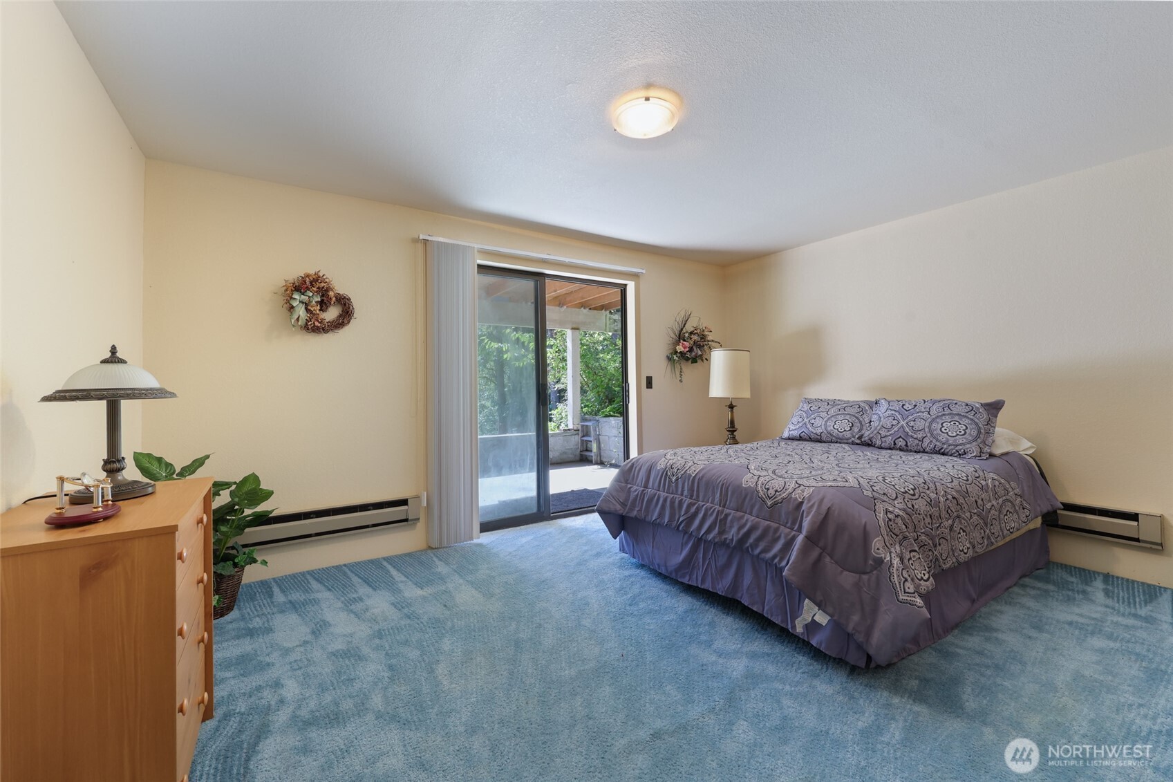 2484 Spencer Road Salkum, WA 98582 - Photo 23 of 36 a spacious bedroom with a bed and a lamp on table