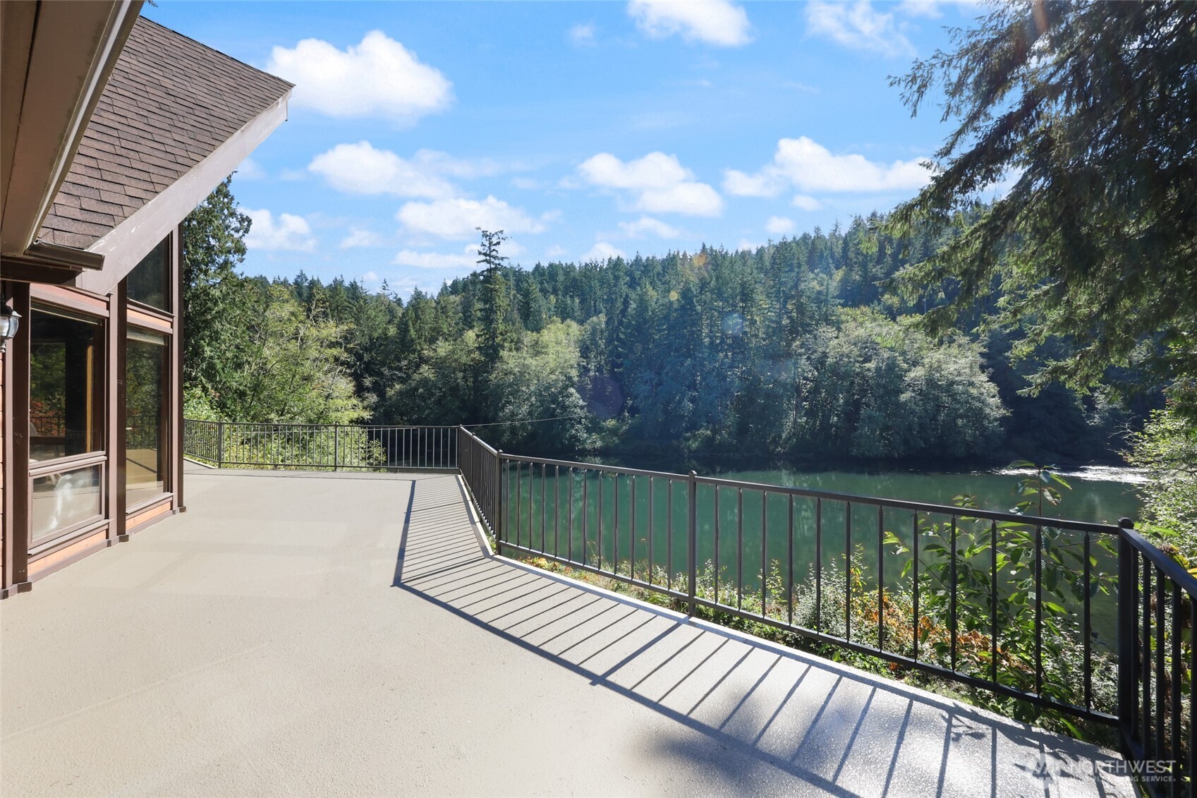 2484 Spencer Road Salkum, WA 98582 - Photo 3 of 36 a view of a lake with a bench next to a lake