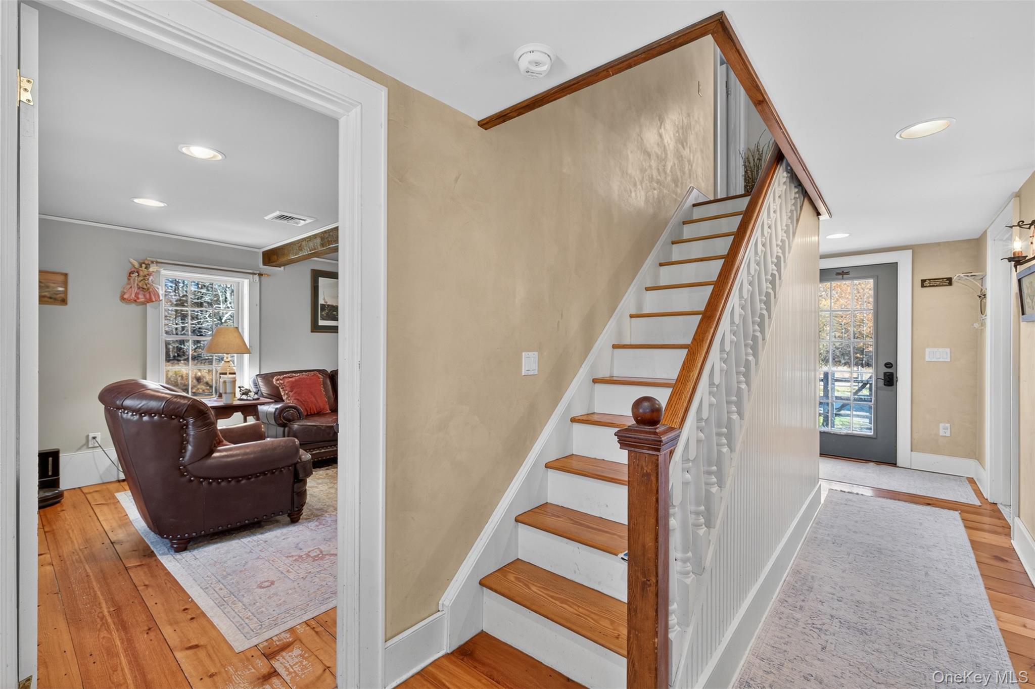 321 Burnt Meadow Road Gardiner, NY 12525 - Photo 12 of 46 a living room with furniture and stairs