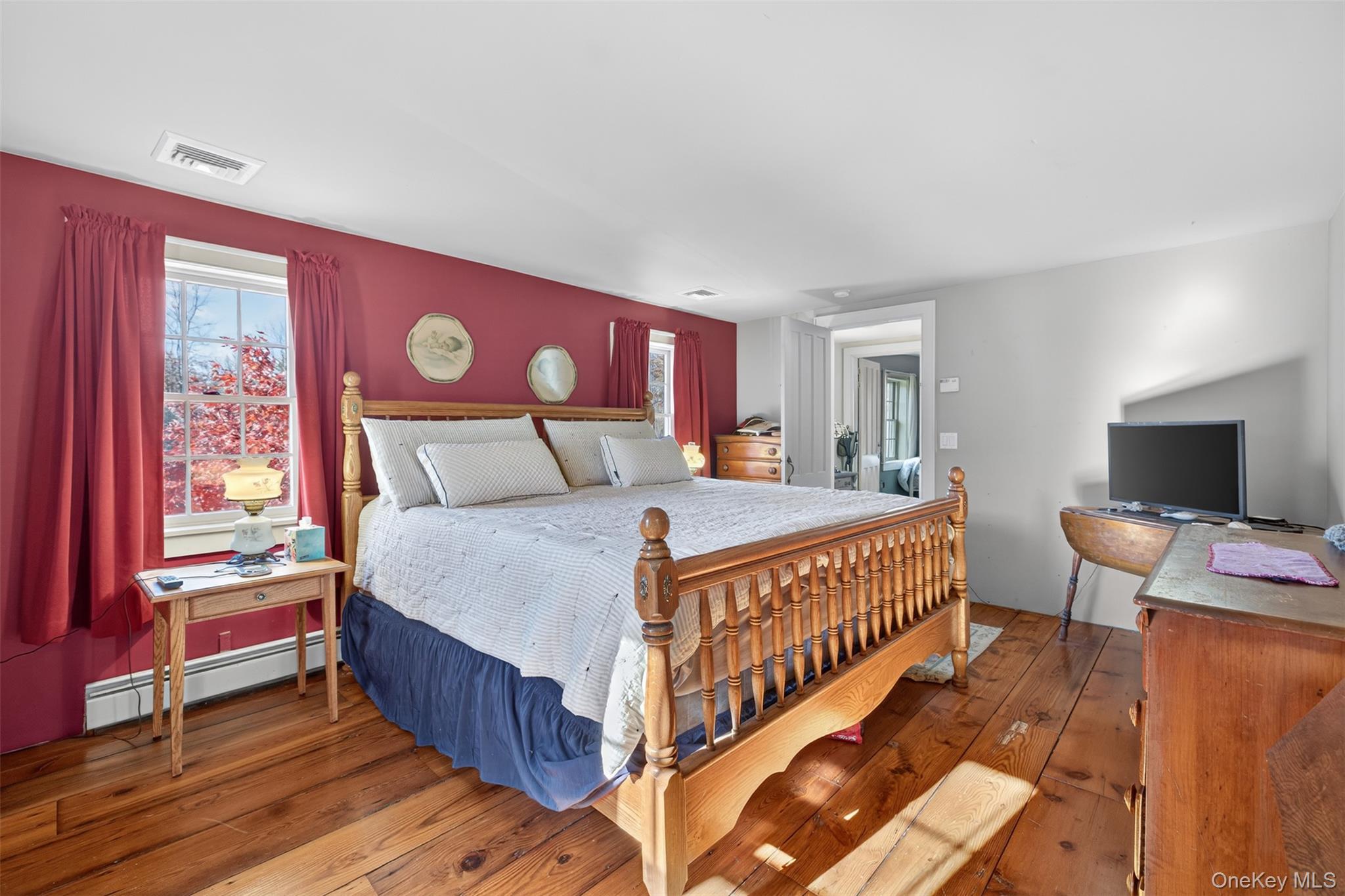 321 Burnt Meadow Road Gardiner, NY 12525 - Photo 13 of 46 a bedroom with a bed and a flat screen tv