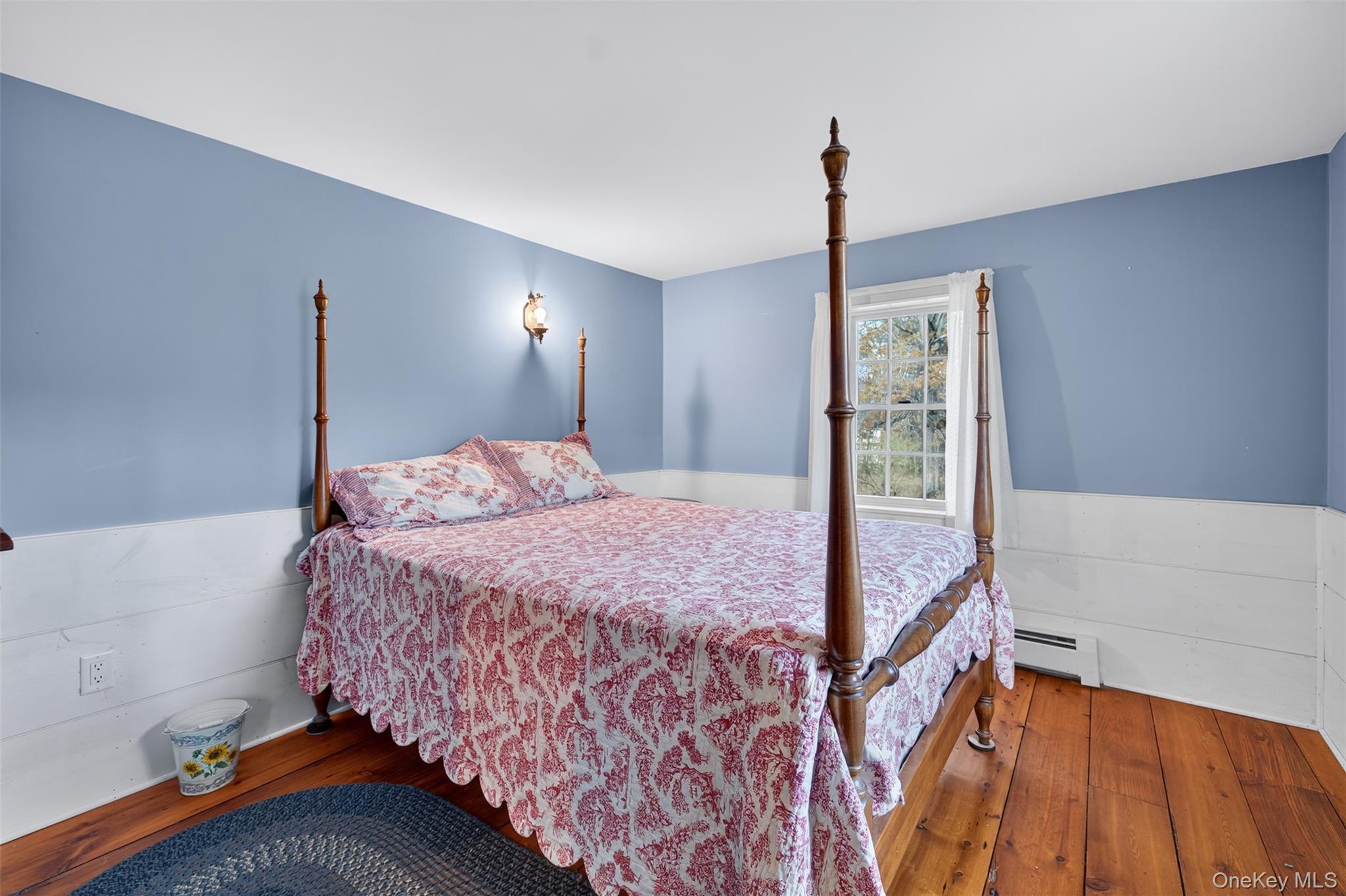 321 Burnt Meadow Road Gardiner, NY 12525 - Photo 16 of 46 a bedroom with a bed and a mirror