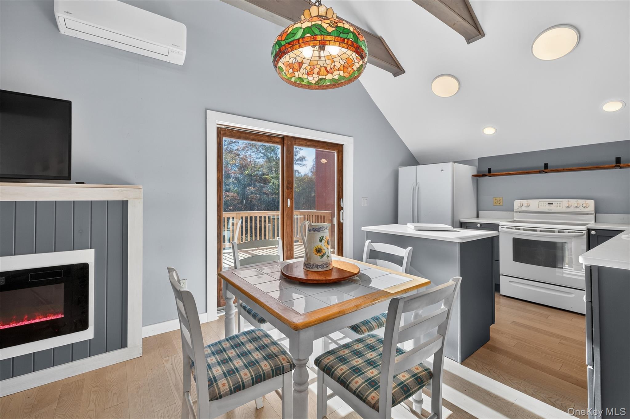 321 Burnt Meadow Road Gardiner, NY 12525 - Photo 24 of 46 a kitchen with stainless steel appliances a stove a microwave a refrigerator and a fireplace
