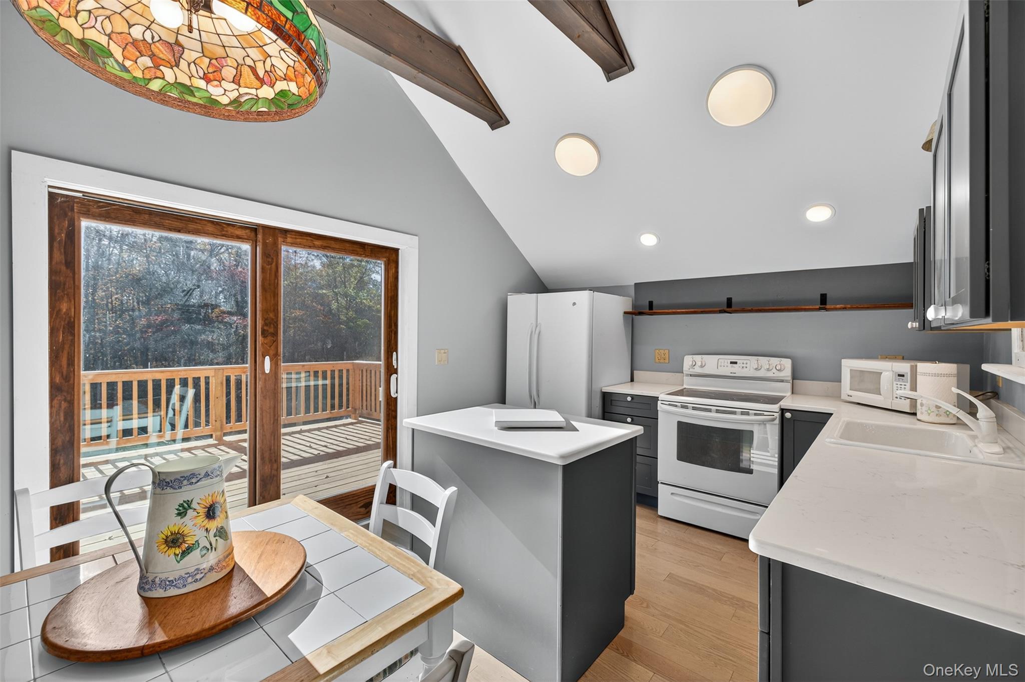 321 Burnt Meadow Road Gardiner, NY 12525 - Photo 26 of 46 a kitchen with a stove a sink and a refrigerator