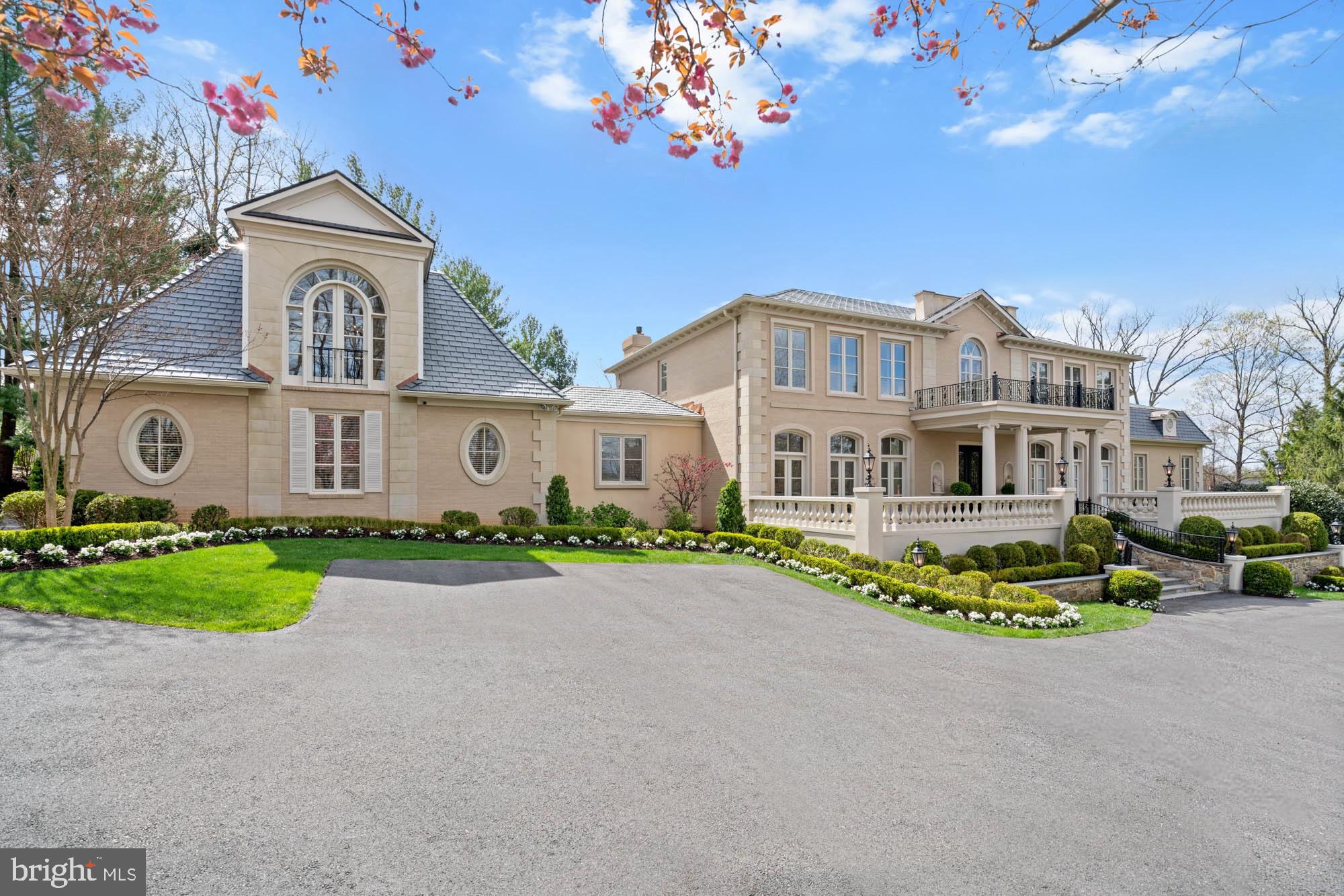1198 Windrock Drive McLean, VA 22102 - Photo 1 of 83 a front view of a house with a garden and trees