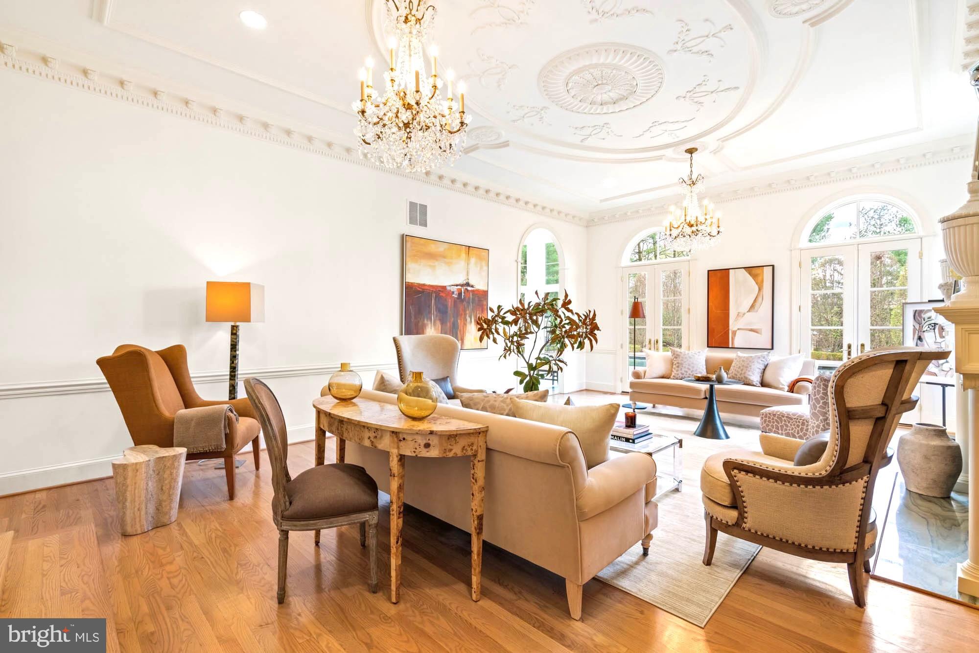 1198 Windrock Drive McLean, VA 22102 - Photo 14 of 83 a living room with furniture a chandelier and a dining table