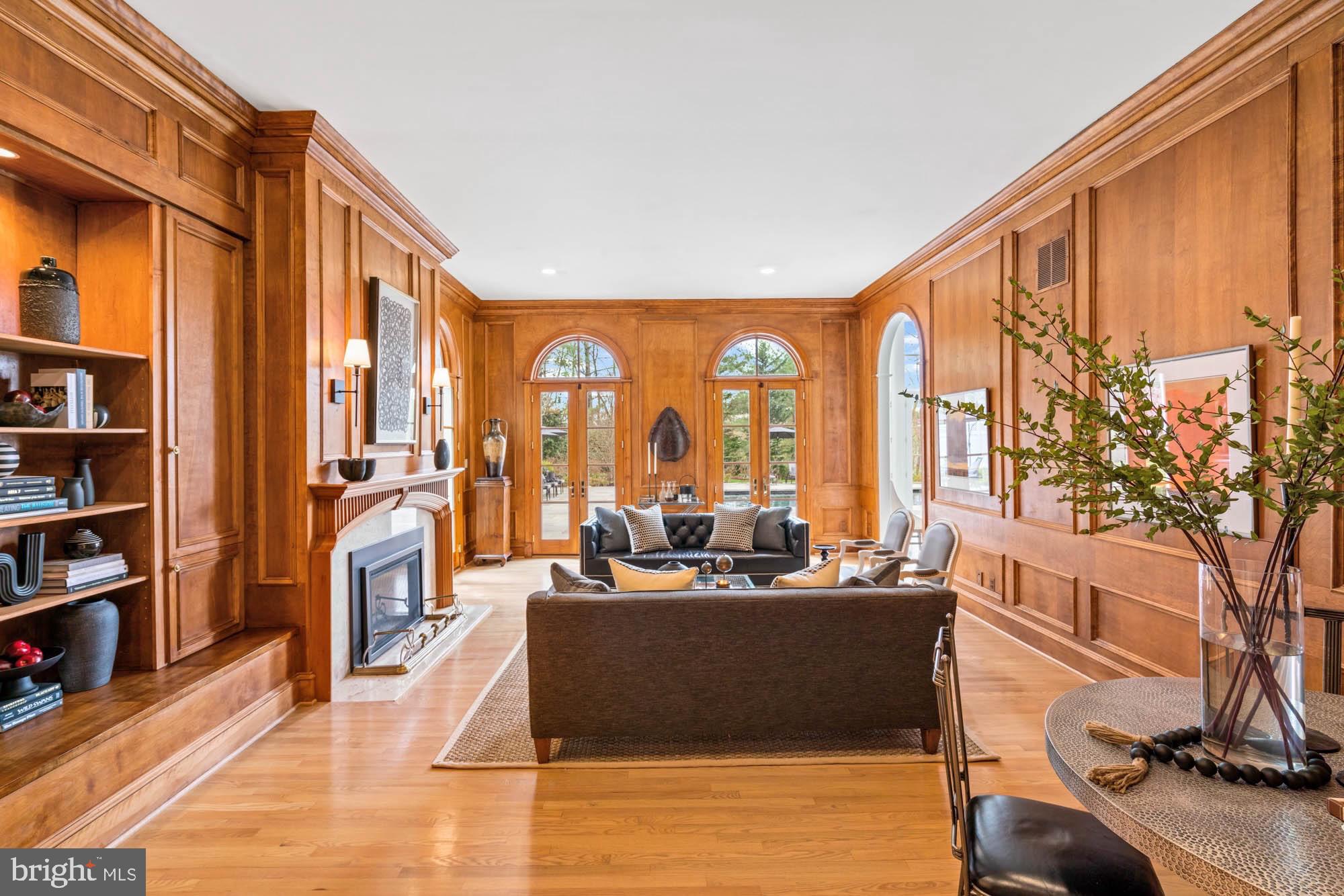 1198 Windrock Drive McLean, VA 22102 - Photo 15 of 83 a living room with large windows and a flat screen tv