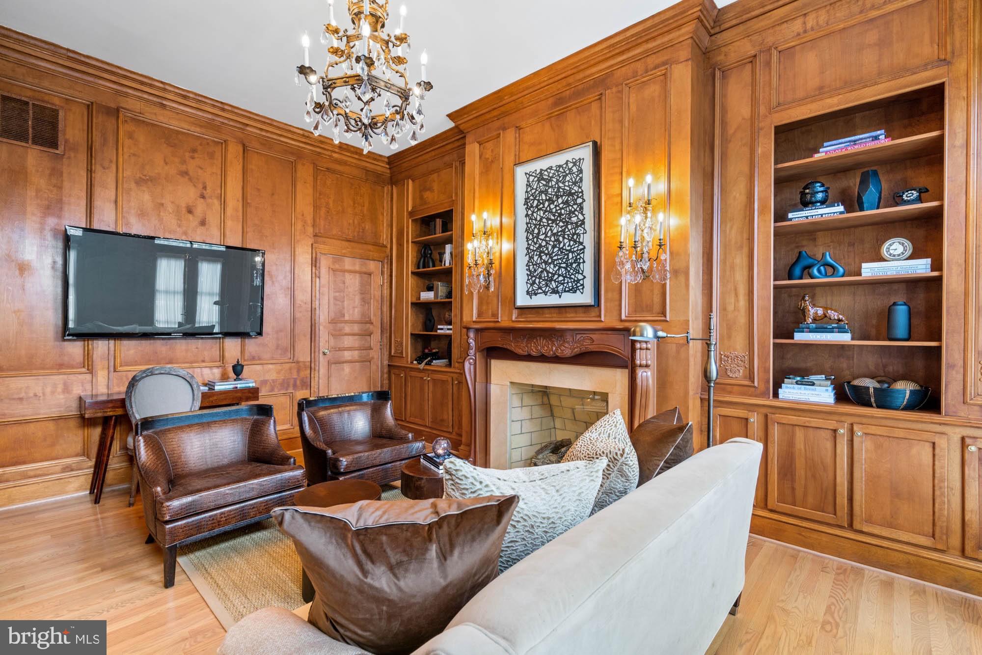 1198 Windrock Drive McLean, VA 22102 - Photo 21 of 83 a living room with furniture a flat screen tv and a fireplace