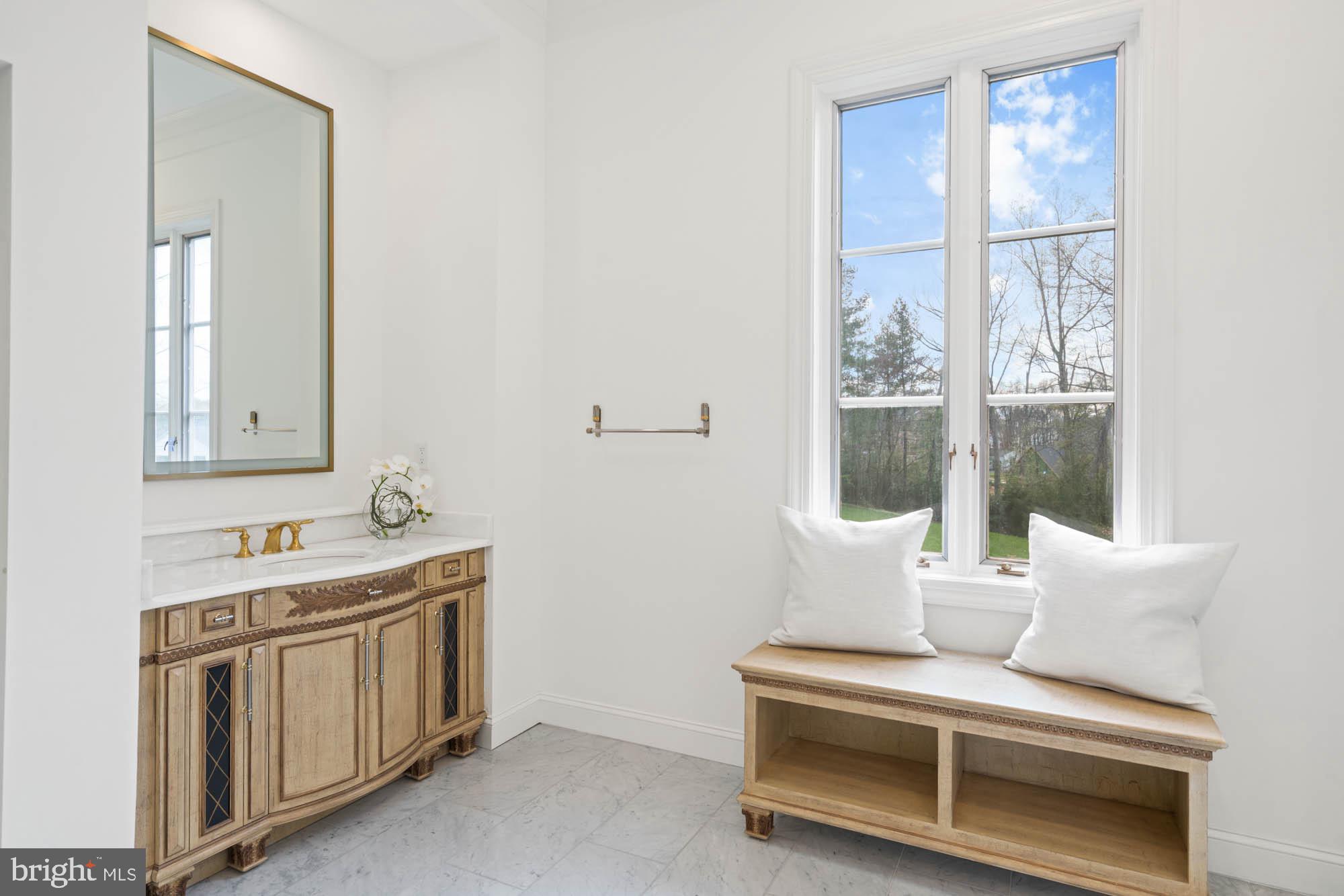 1198 Windrock Drive McLean, VA 22102 - Photo 47 of 83 a bathroom with a sink and a mirror
