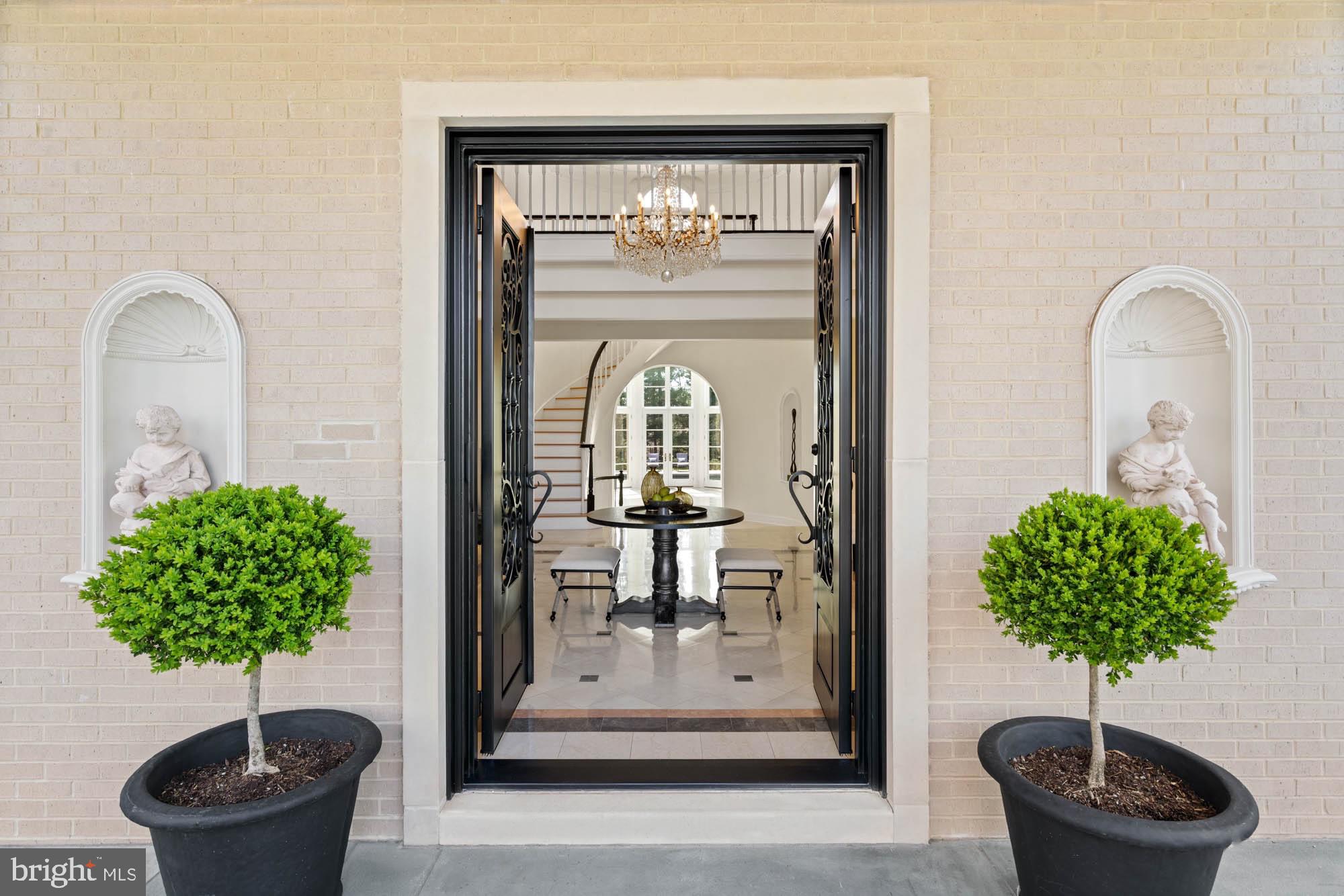 1198 Windrock Drive McLean, VA 22102 - Photo 5 of 83 a vase of flowers sitting on a table in front of a door