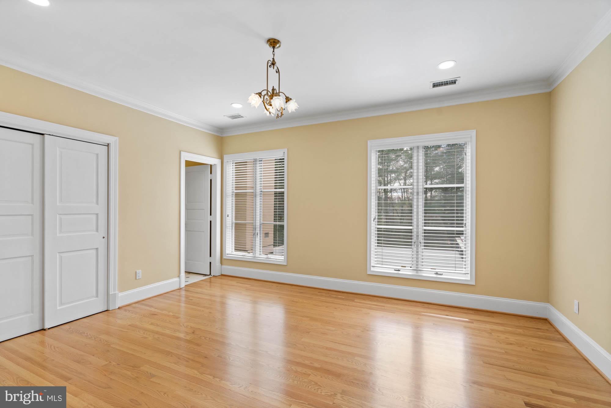 1198 Windrock Drive McLean, VA 22102 - Photo 55 of 83 a view of an empty room with a window and wooden floor