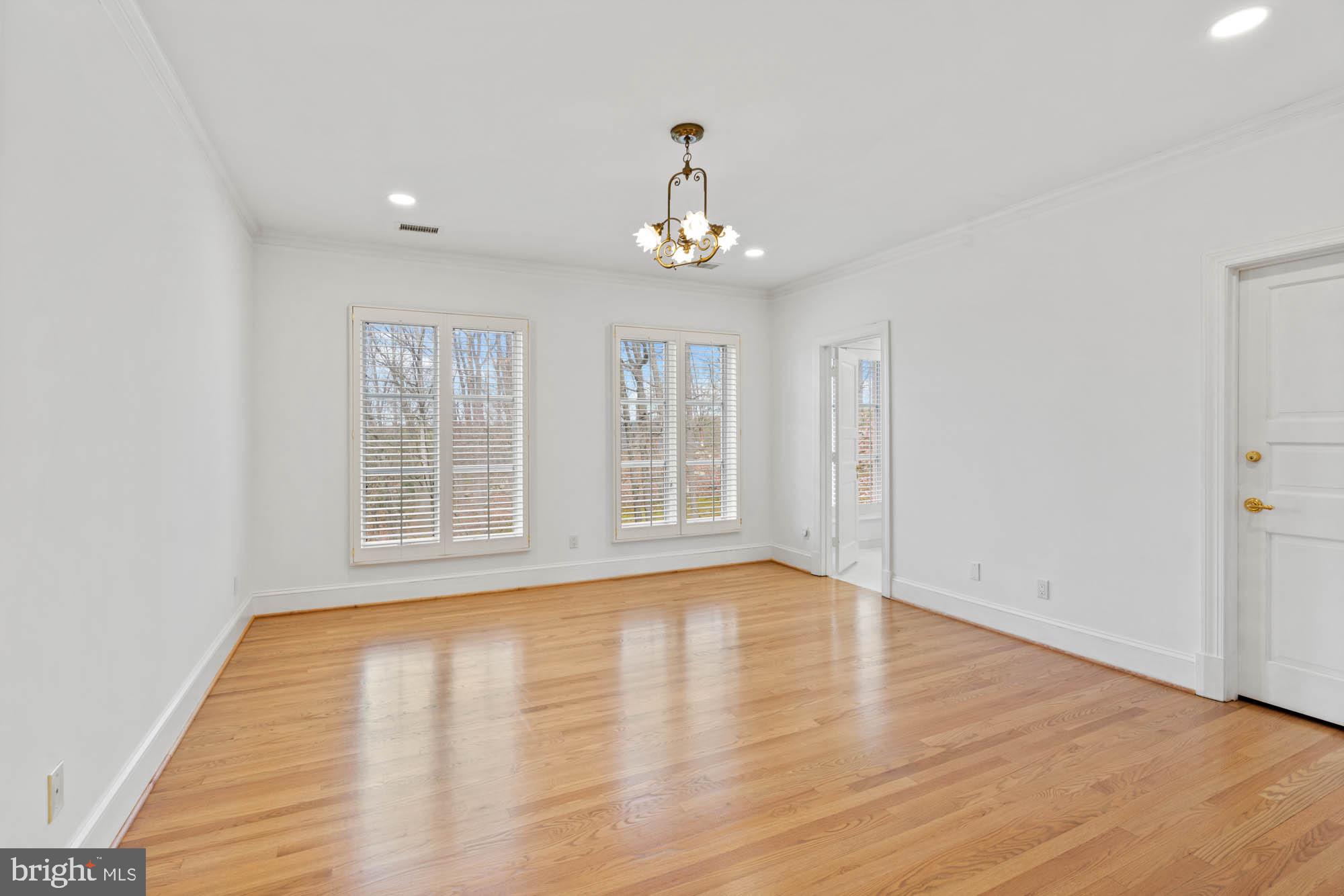 1198 Windrock Drive McLean, VA 22102 - Photo 56 of 83 an empty room with wooden floor cabinet and windows