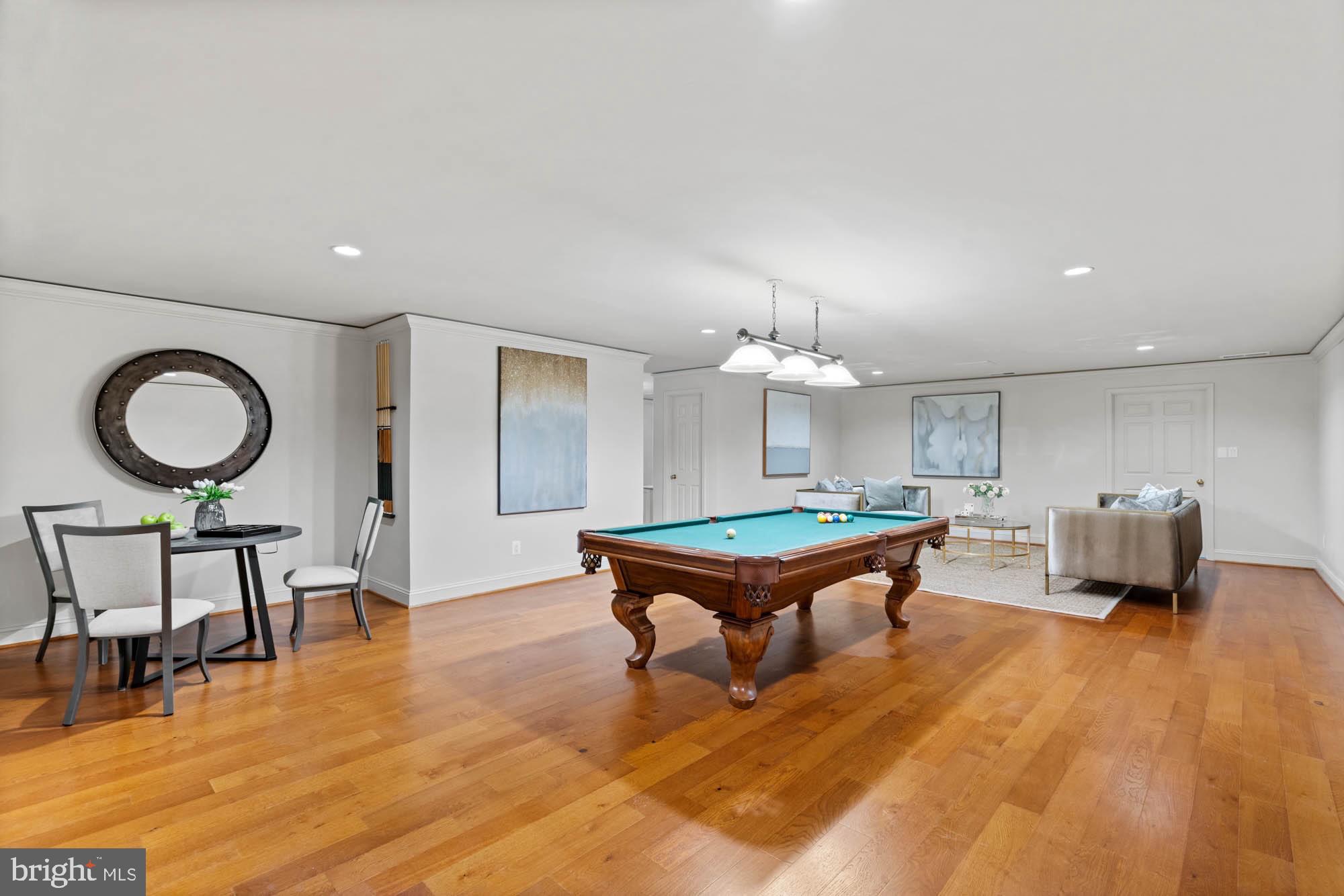 1198 Windrock Drive McLean, VA 22102 - Photo 70 of 83 a living room with furniture a dining table and a chandelier