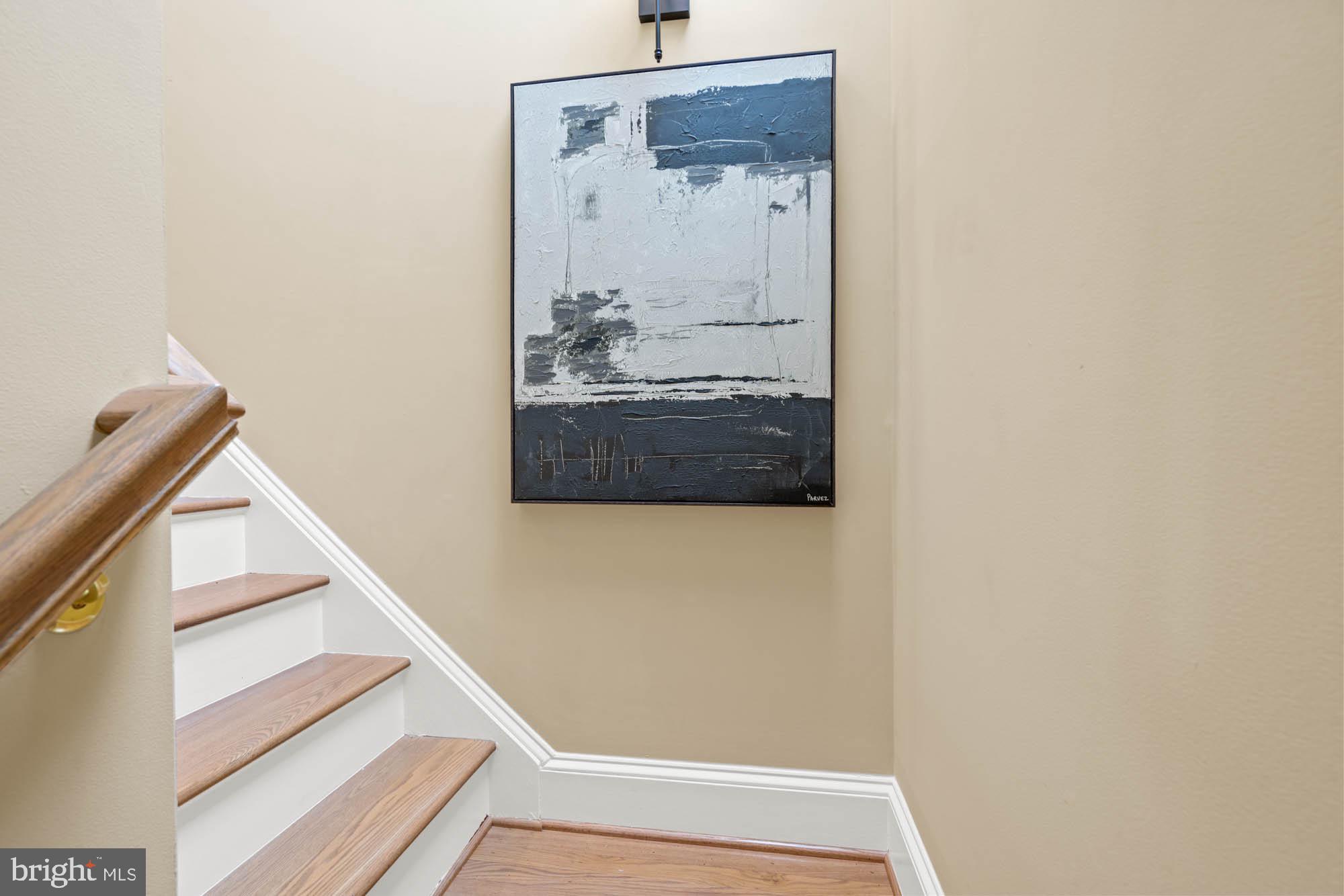 1198 Windrock Drive McLean, VA 22102 - Photo 75 of 83 a view of a hallway with wooden floor and staircase