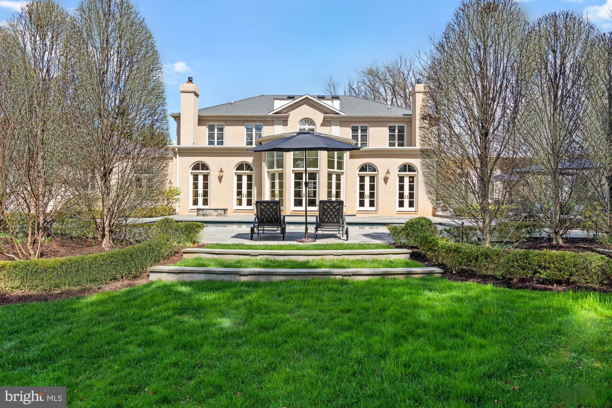 1198 Windrock Drive McLean, VA 22102 - Photo 78 of 83 a front view of a house with a yard table and chairs
